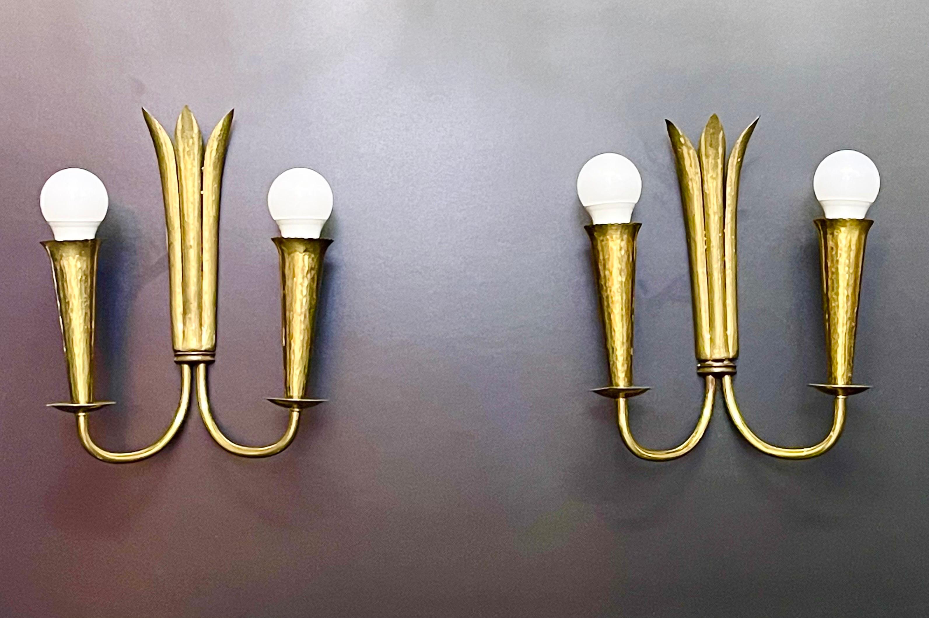 A pair of mid- century Scandinavian hammered brass wall sconces, circa 1950s.
Socket: each 2 x E27 for standard screw bulbs.






 