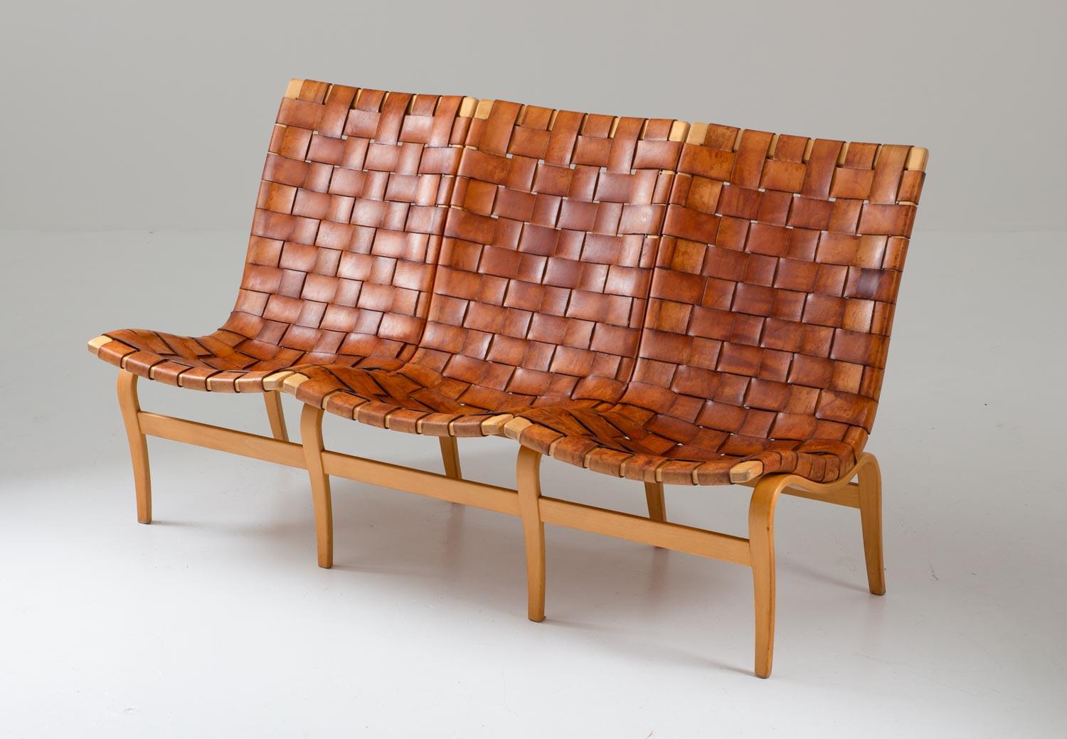 Rare “Eva” three-seat sofa by Bruno Mathsson, with a wreathed leather seat on a beech bentwood frame. Perfect patinated naturally colored leather. Manufactured in 1966 by Firma Karl Mathsson, Sweden.

Condition: The wooden frame is in very good
