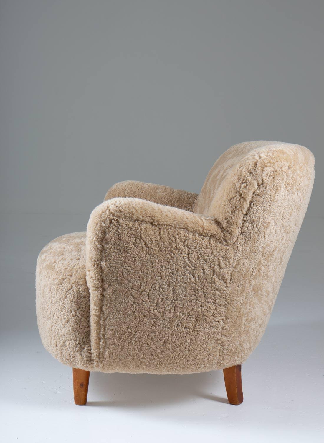 Scandinavian Mid Century Lounge Chairs in Sheepskin In Good Condition For Sale In Karlstad, SE