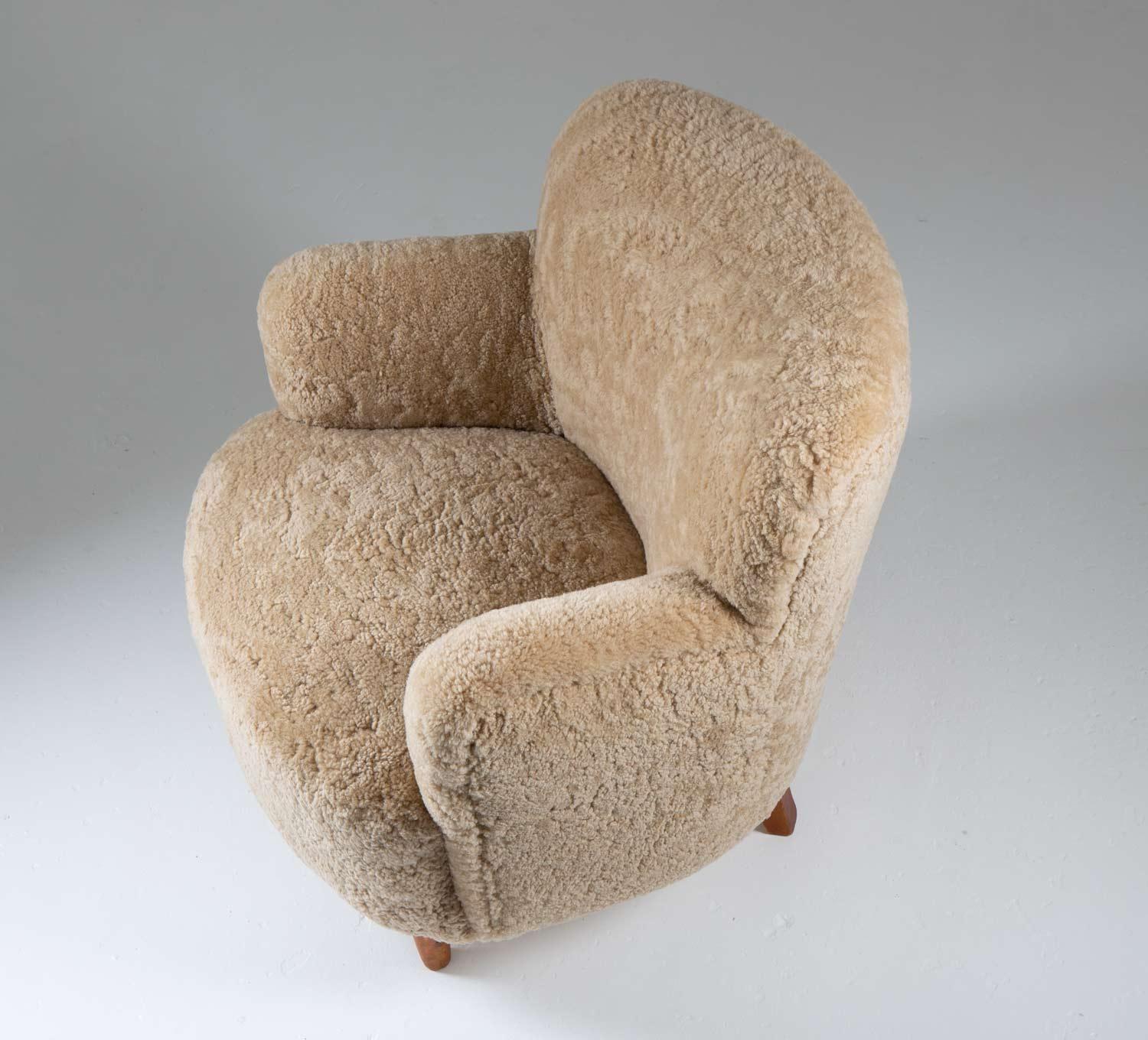 20th Century Scandinavian Mid Century Lounge Chairs in Sheepskin For Sale