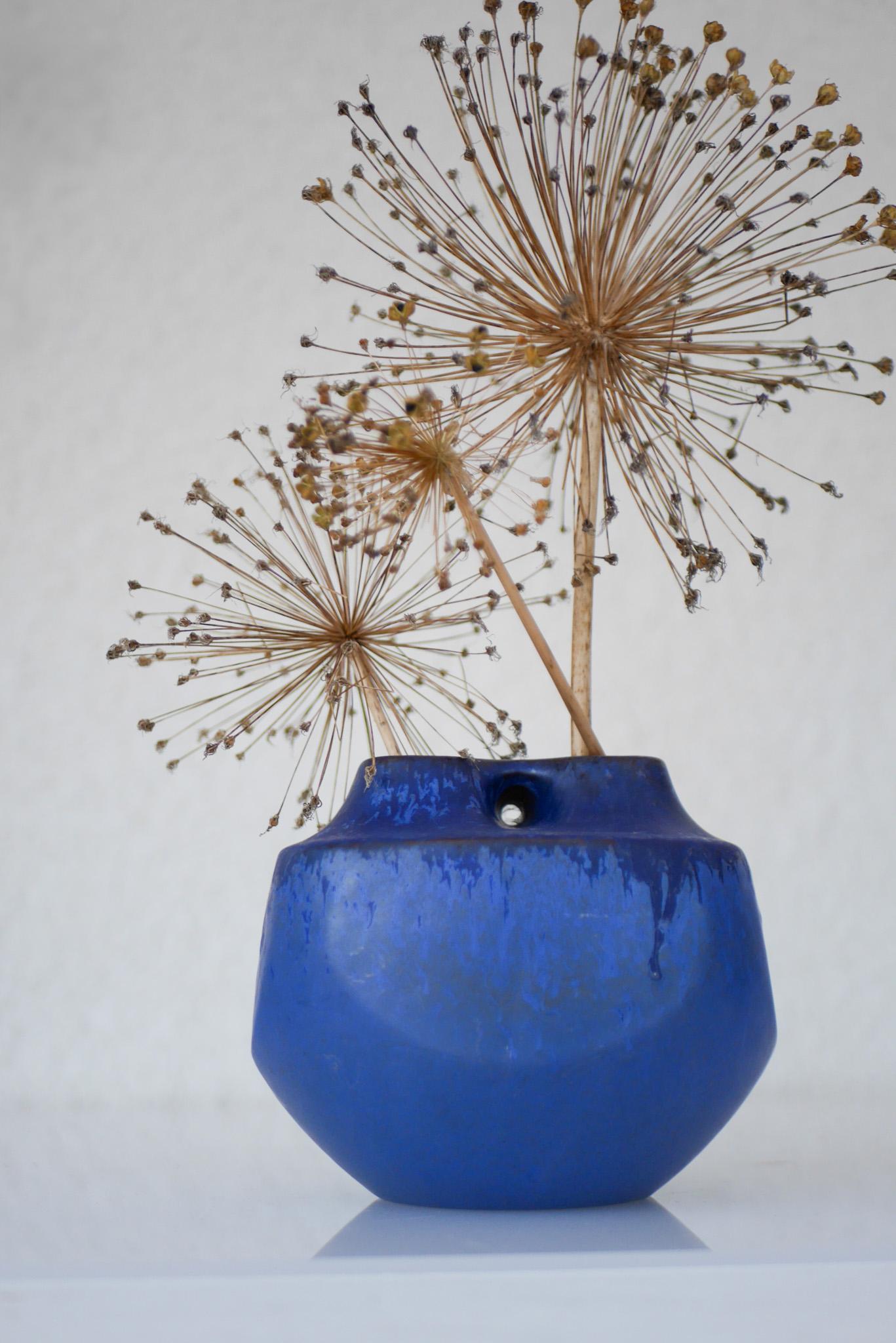 Mid-century modern Scandinavian pottery vase, ikebana style, an unusual and equally fantastic piece from Knabstrup, Denmark. This piece has a very 70's feeling to it and has an amazing color and glazing a warm nearly vibrant blue contrasted with