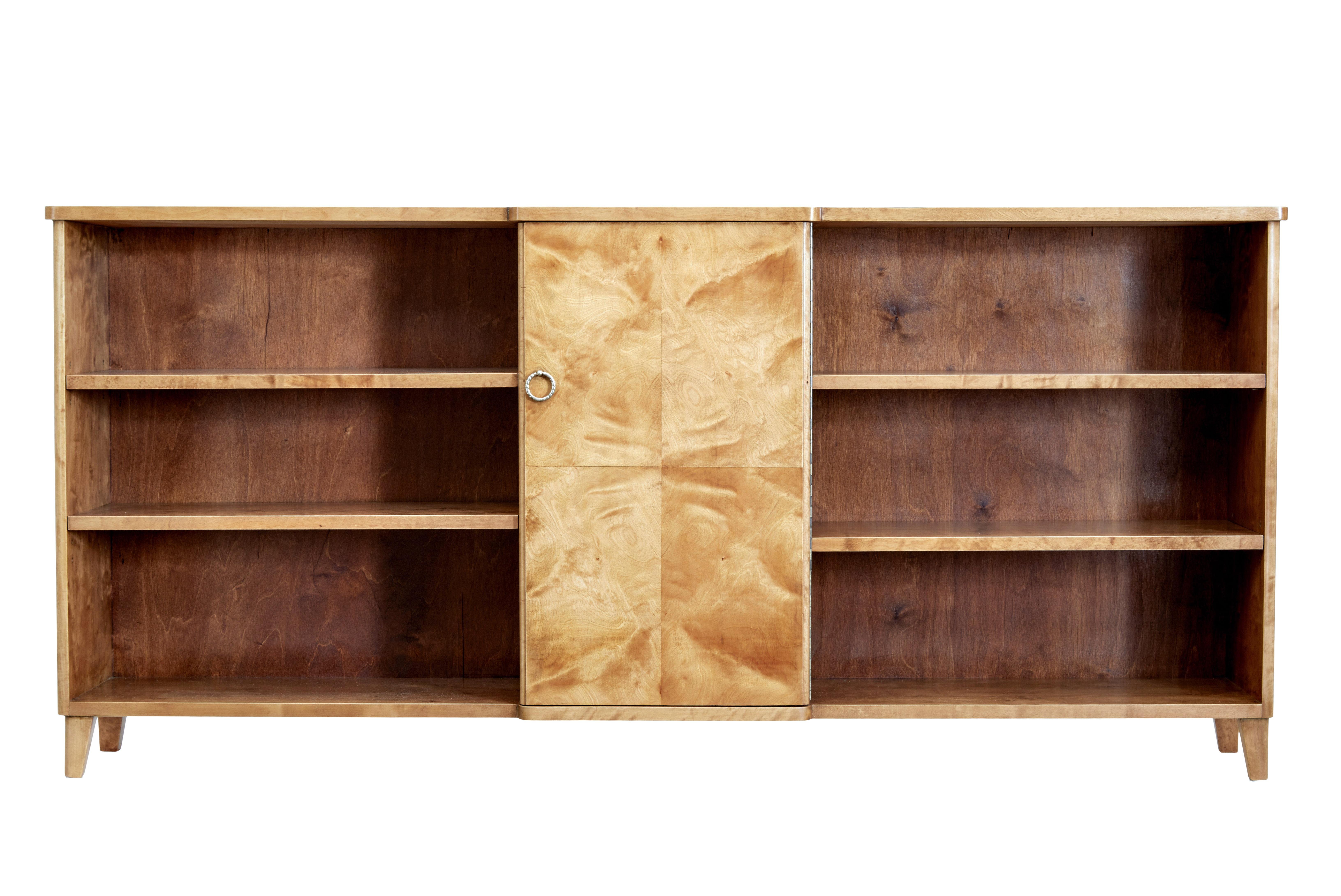 Scandinavian Mid-Century Modern birch low bookcase, circa 1950.

Stylish and practical piece of Swedish design, allowing maximum storage with minimum space.  This piece lends itself to being able to used in multiple rooms around the