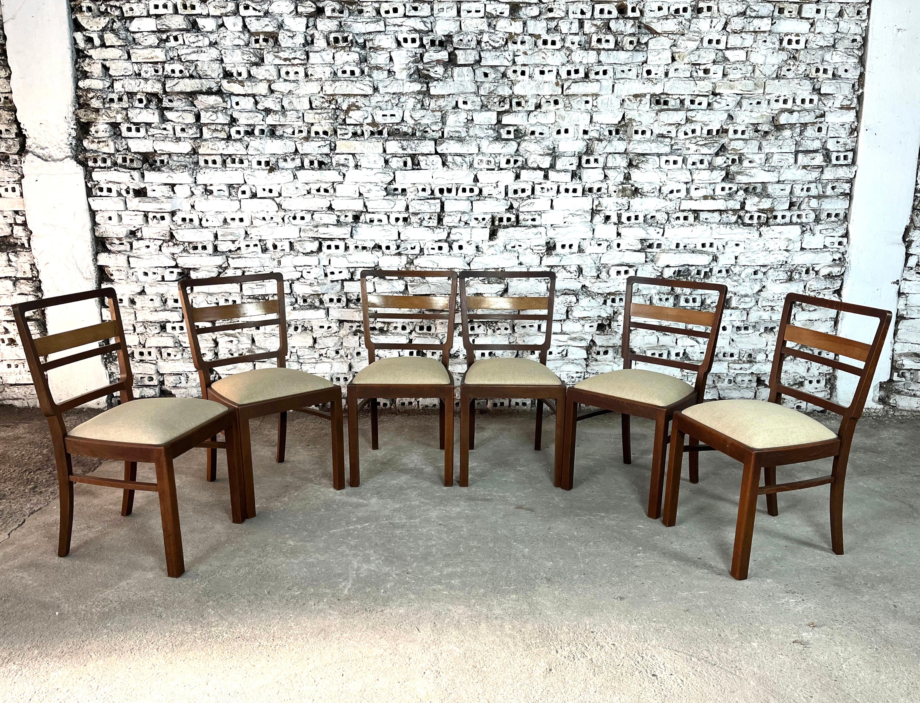 Dimensions: H 35.2” x W 18.1” x D 15.1” x SH 19.6”

Set of 6 Scandinavian Mid-Century Modern dining chairs with newly upholstered seats in beige fabric. Each chair has a little pitched back with three ladders across for great support and