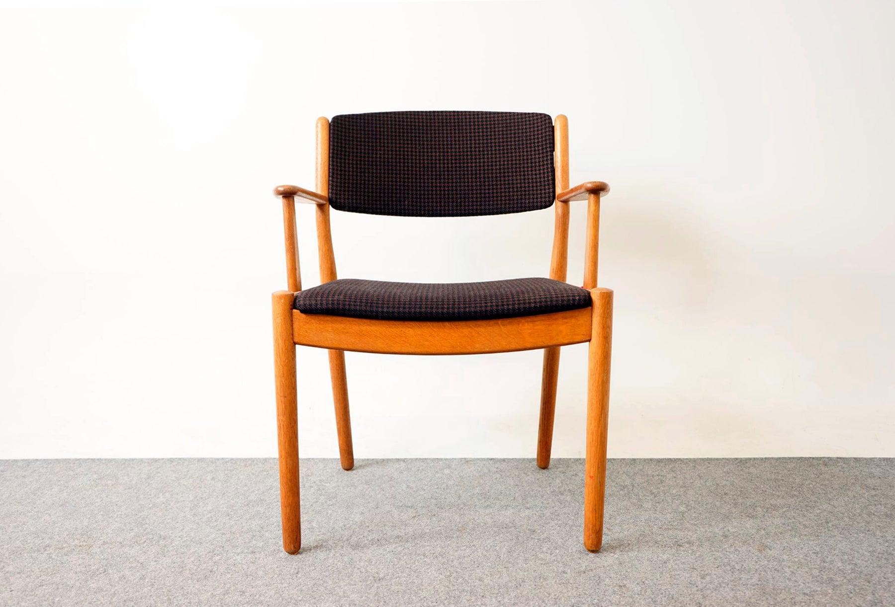 Oak mid-century arm chair, circa 1960's. Sturdy solid wood frame is wonderfully scaled for your many seating needs around the urban home. Upright upholstered back provides support and comfort. Clean modern design makes it easy to combine with other