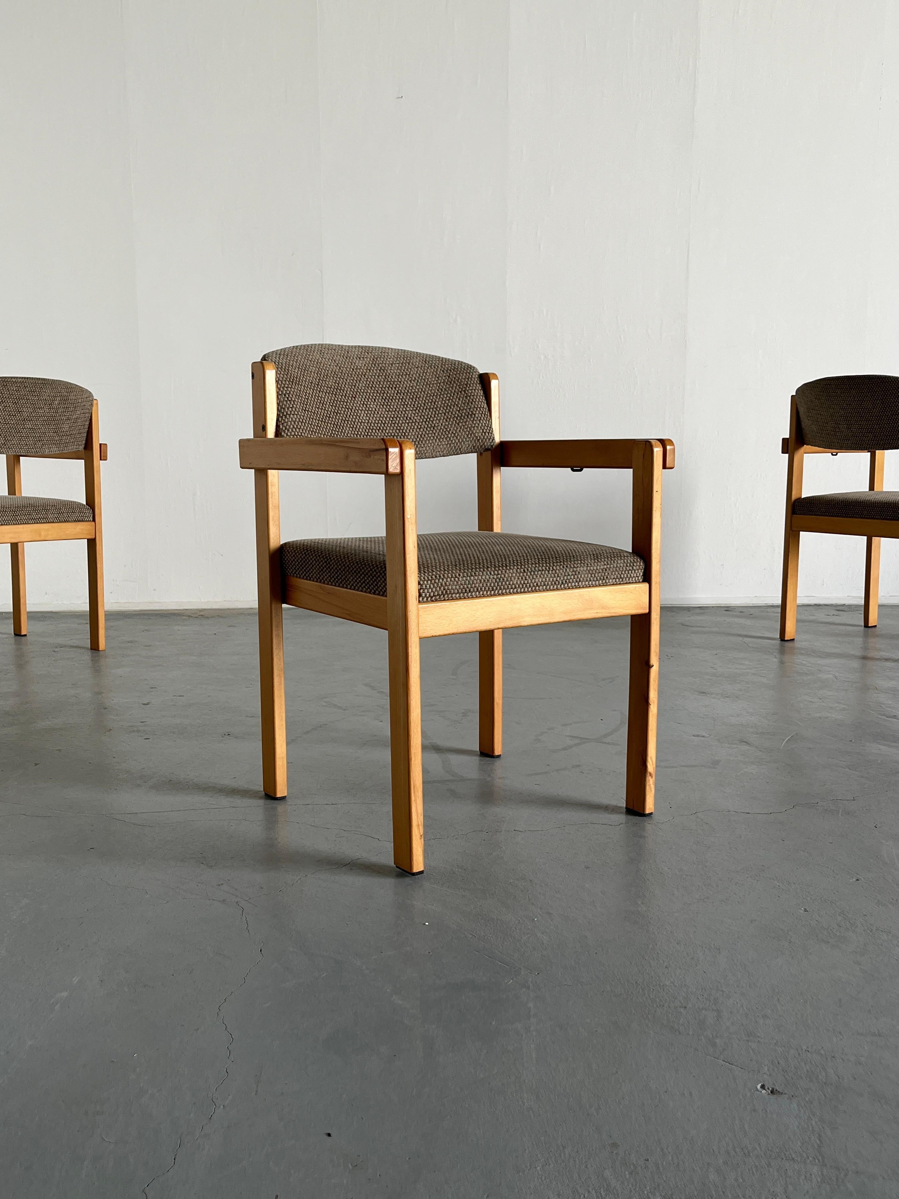 Scandinavian Mid-Century Modern stackable dining chairs or side armchairs in solid wood and amazing grey knitted upholstery, with shades of green and brown. 
Can be connected to create a seating bench 
High production quality.

Original vintage