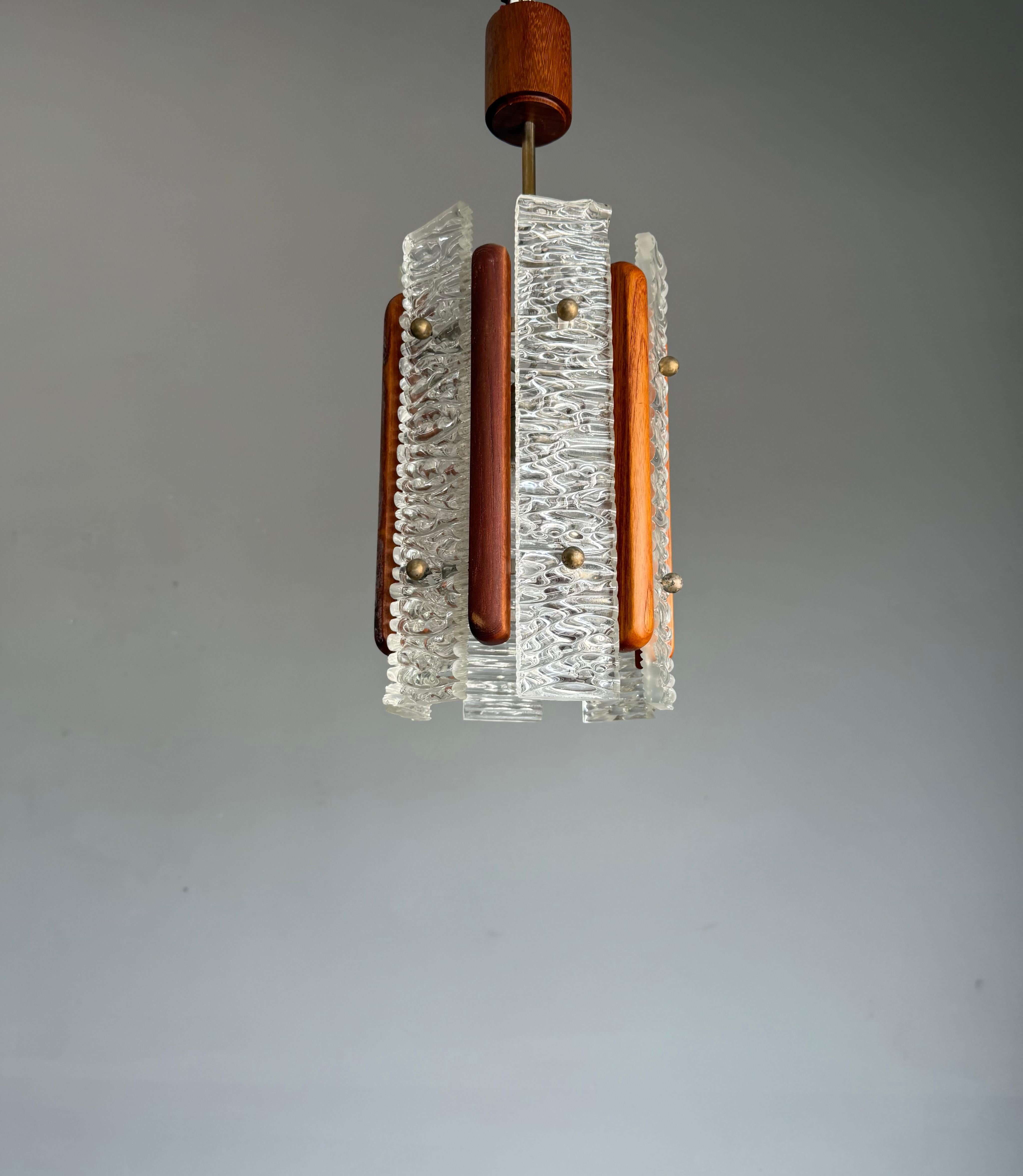 Scandinavian style, MidCentury hallway ceiling lamp of great shape and color.

This handcrafted mid-century Scandinavian pendant from the 1960s is a striking example of geometric elegance and material harmony. Its bold yet refined silhouette