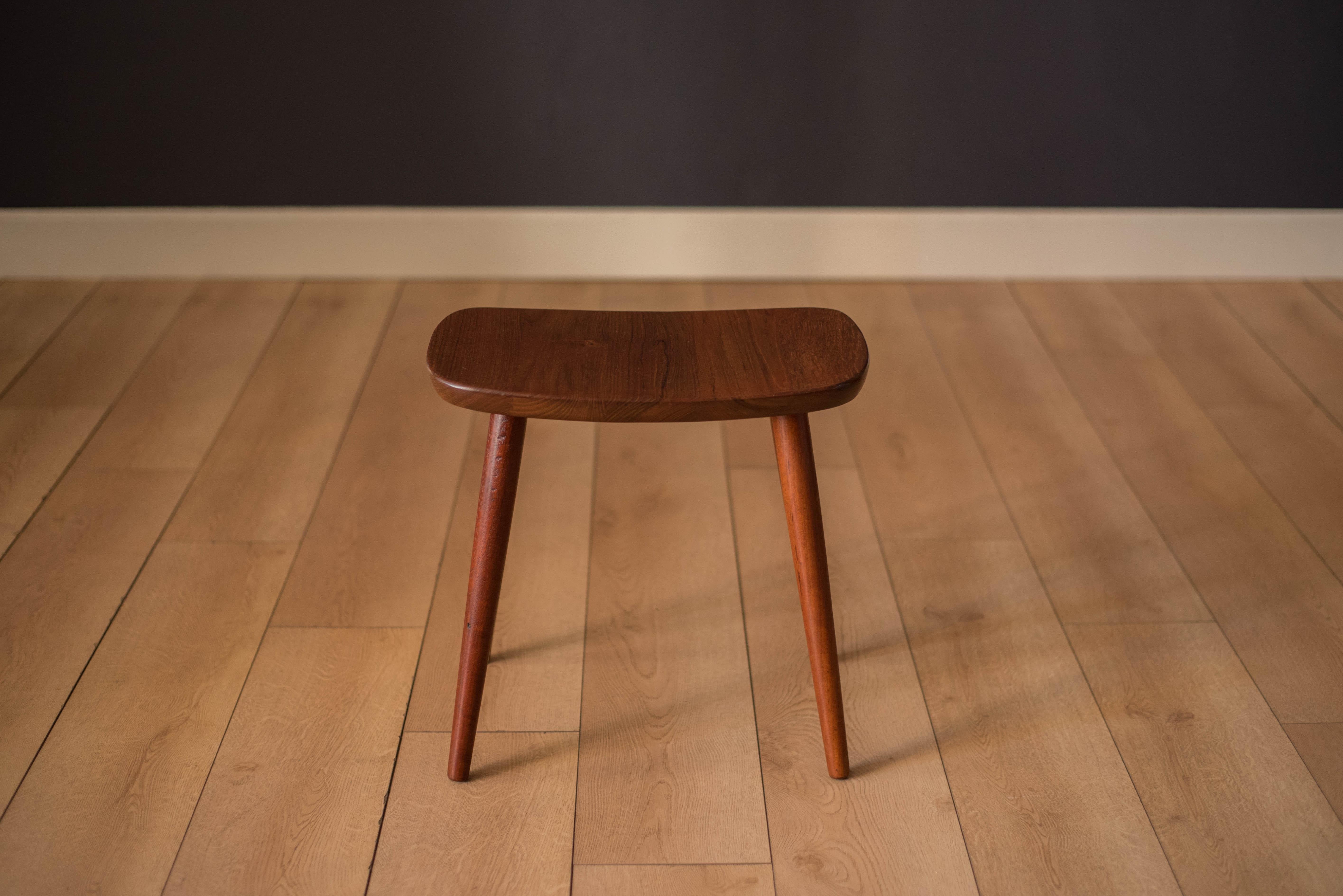 Vintage teak stool made in Sweden, circa 1960s. This rare piece is made of old growth solid planked teak supported by four splayed dowel legs. Functions as a sitting stool or as a single end table.


Offered by Mid Century Maddist