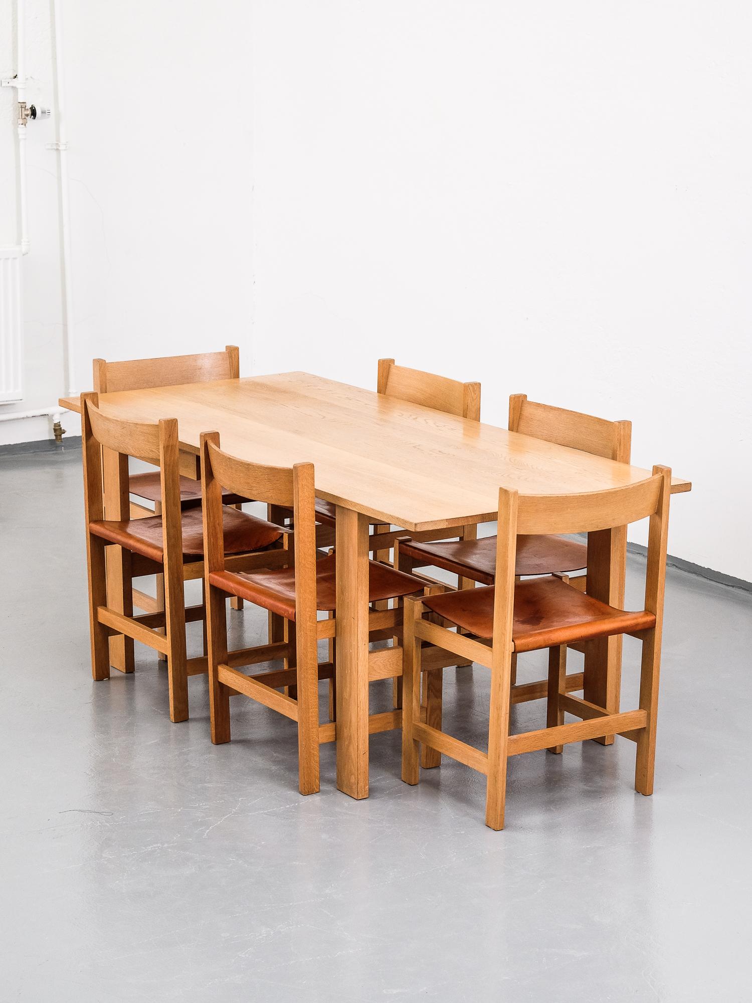 Great set of six Scandinavian midcentury oak and leather chairs and a dining table made of oak.

Unknown manufacturer. Beautiful patina on leather sling seats.

Table measurements:
180 cm x 79.5 cm
Height 72.5 cm

Chair measurements:
Width