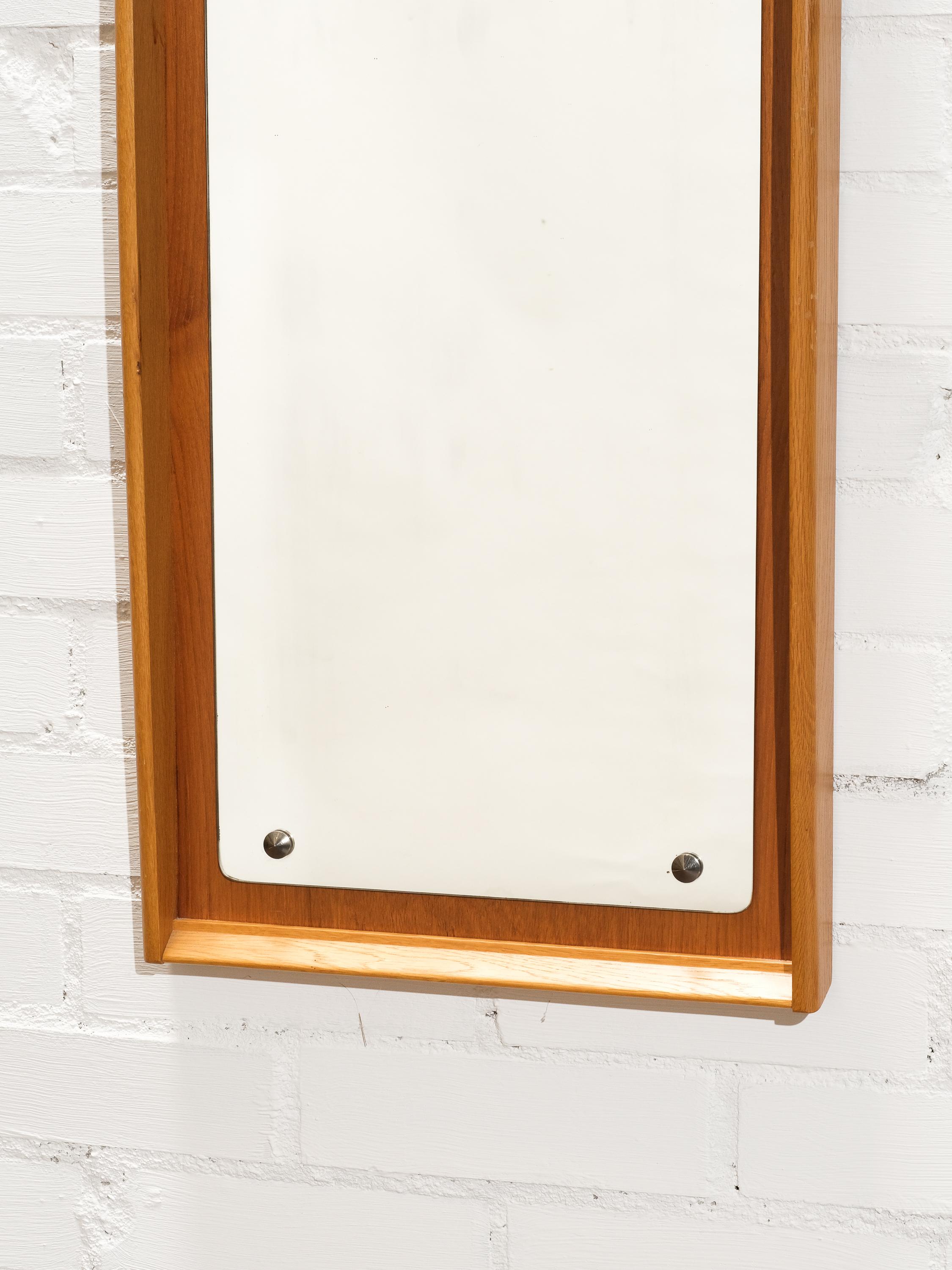 Oak and teak framed wall mirror. Produced in Scandinavia, 1950s.