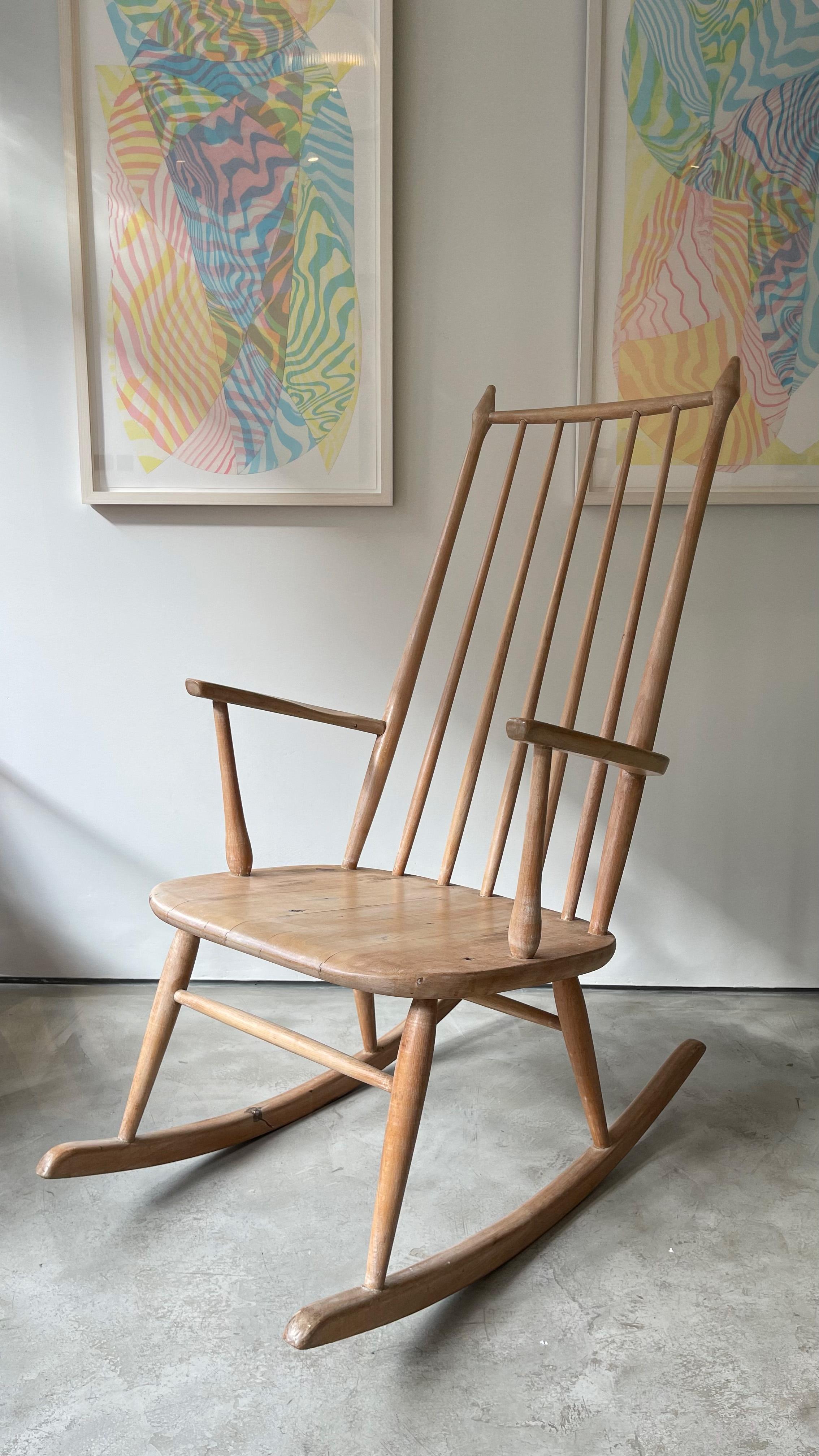 Skandinavian Oak Mid Century Rocking Chair.

Designer and manufacturer are unknown, though it appears to have been stripped back at some point. The design echos many other great designers of the time, Varjosen Puunjalostus, Yvgne Ekstrom and Ilmari