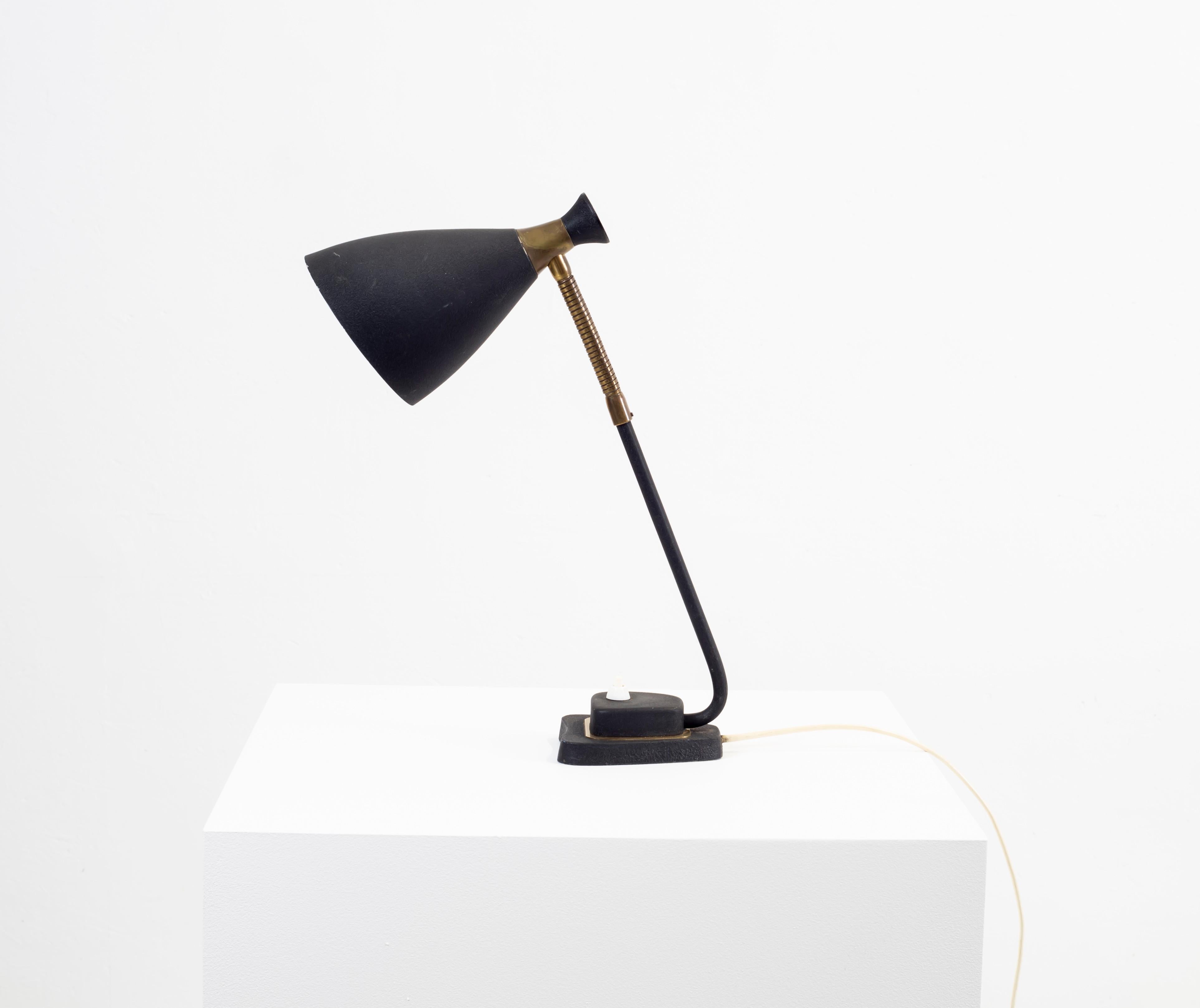 Decorative and modernist table lamp in steel with a black powder coating. Designed and made in Norway from circa 1950s second half. The lamp is fully working and in good vintage condition.