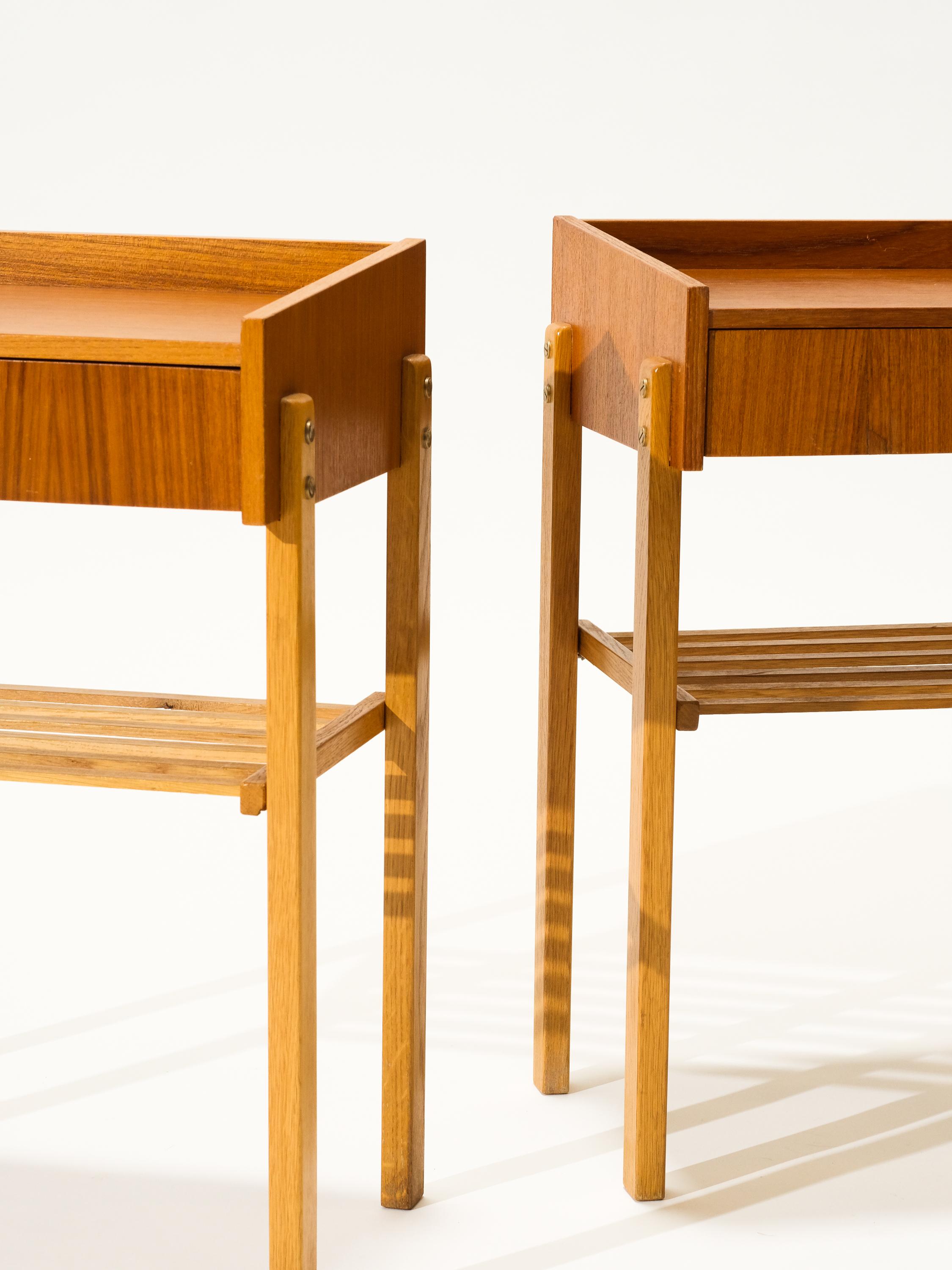 This set of two teak veneer bedside tables was made in Sweden during the 1950s. They have a drawer and a handy shelf. The legs are made of solid oak wood. This set is perfect match to modernist and classic trend.

Tables are in original vintage