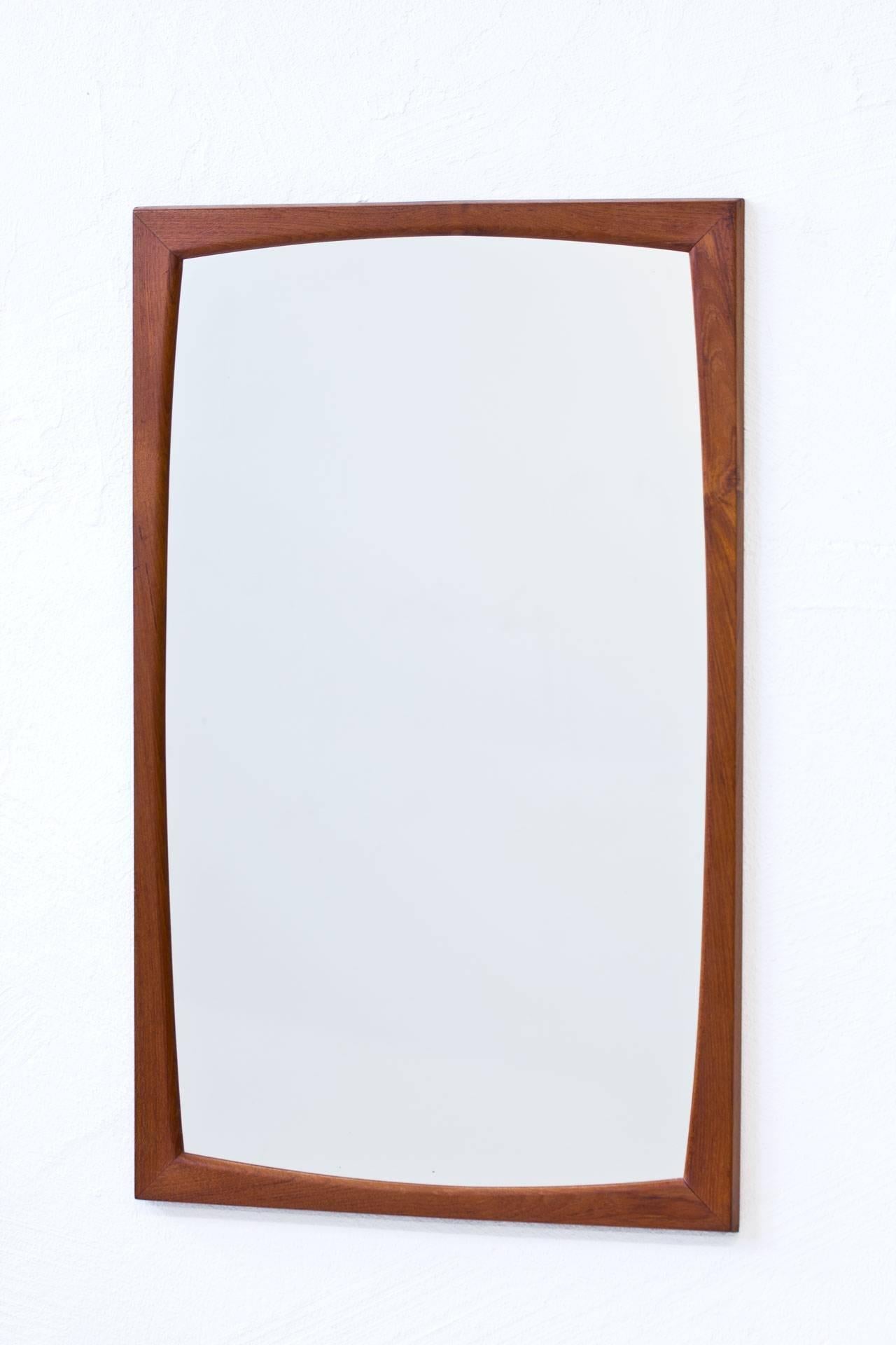 Rectangular wall mirror N° 103 designed by Kai Kristiansen. Produced in Denmark by Aksel Kjaersgaard during the 1950s. Solid teak Frame. Signed on the back.