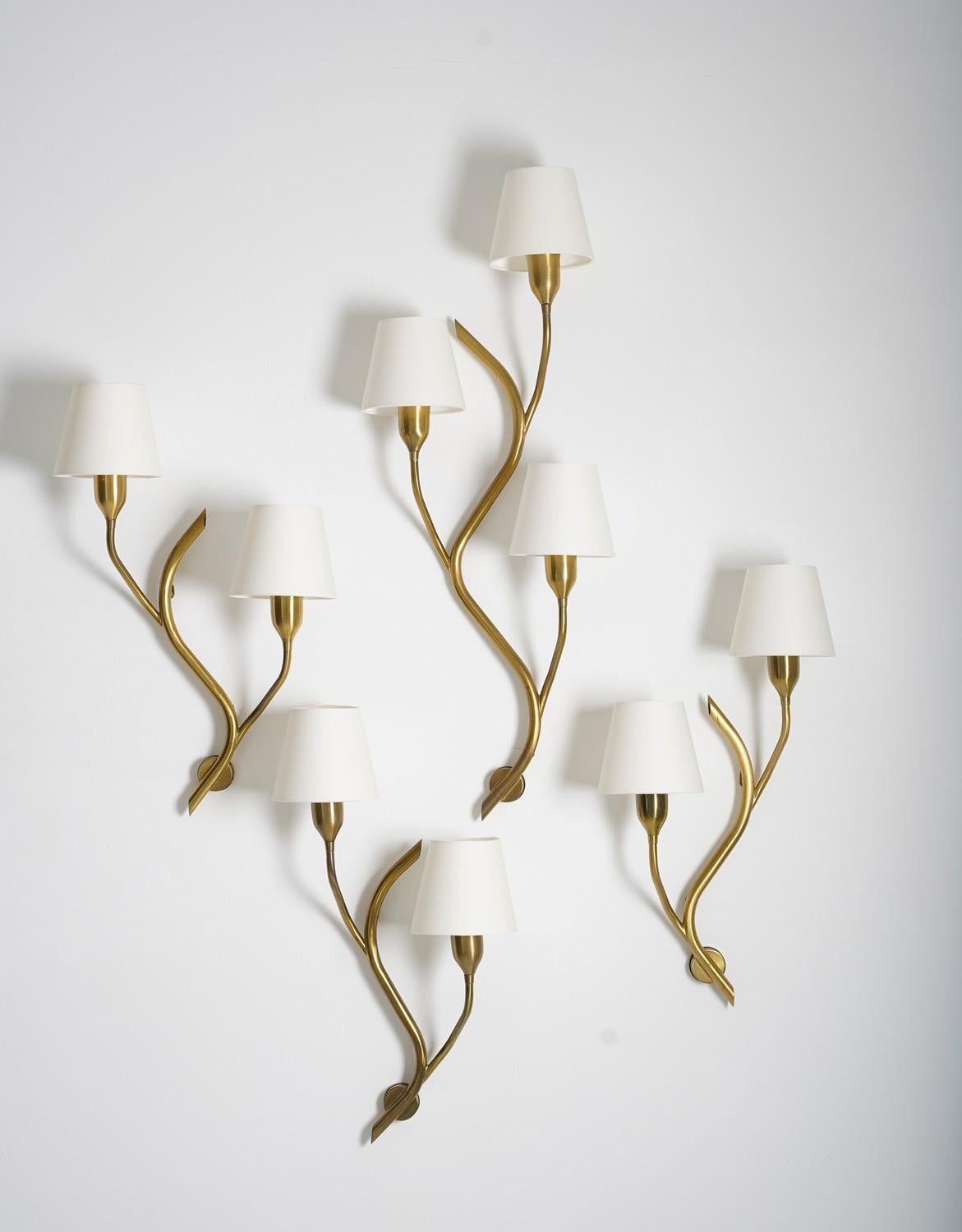 Set of four wall lamps produced by Astra, Norway, 1950s.
Stunning organically-shaped wall lamps, creating a perfect group. The group consists of three lamps with two light sources and one large lamp with three light sources. The lamps come with new