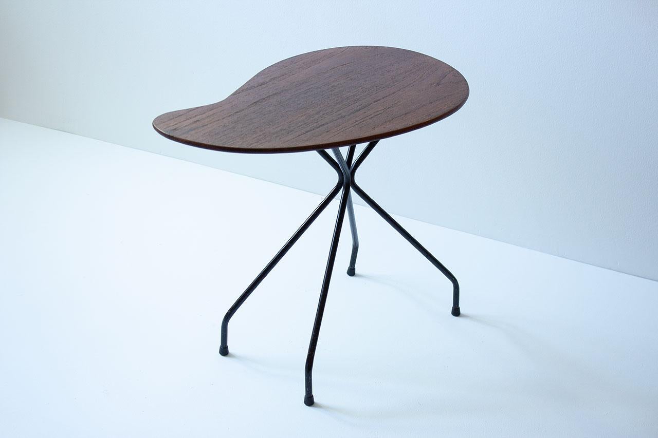 Side or  coffee table bean shaped from unknown maker, most likely
manufactured in Sweden during the 1950s. 
Made from teak table top with  steel  tube  legs.  