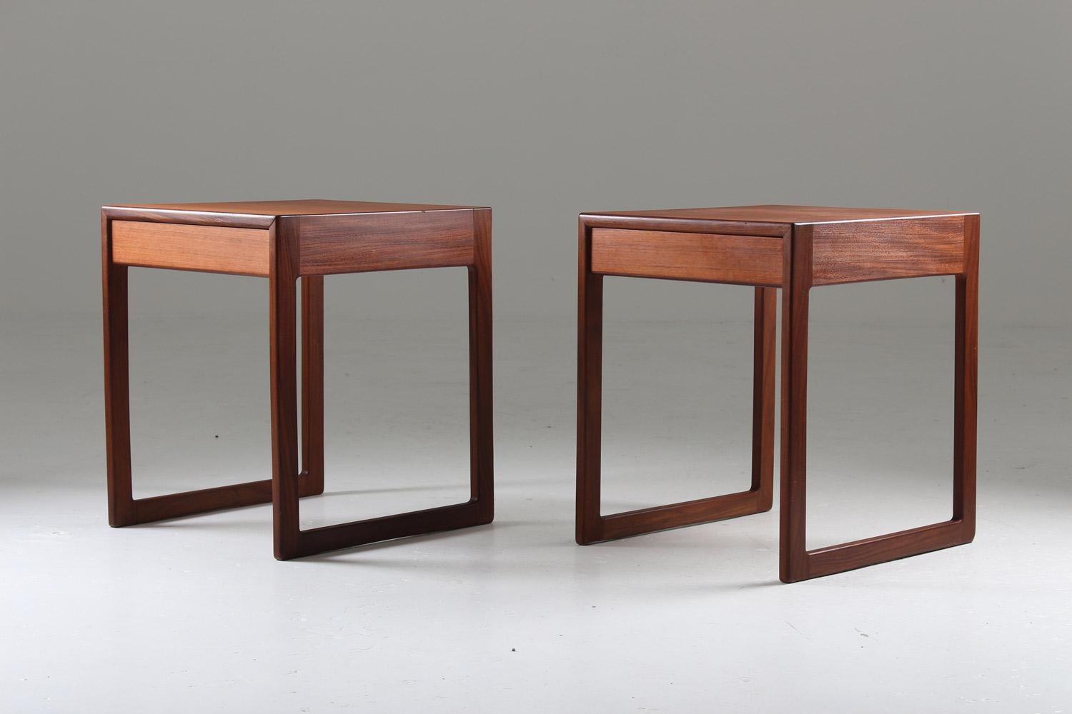 A pair of bedside tables in teak, probably produced in Sweden, 1960s.
These bedside tables show a very minimalistic design with great details. It is made of different shades of teak which contrast beautifully.
Condition: Very good condition. The
