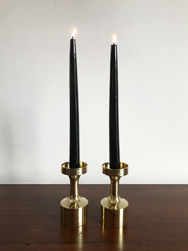Set of two Scandinavian midcentury modern design brass candleholders, Denmark circa 1950s.
Please note that the items are original of the period and this shows normal signs of age and use.