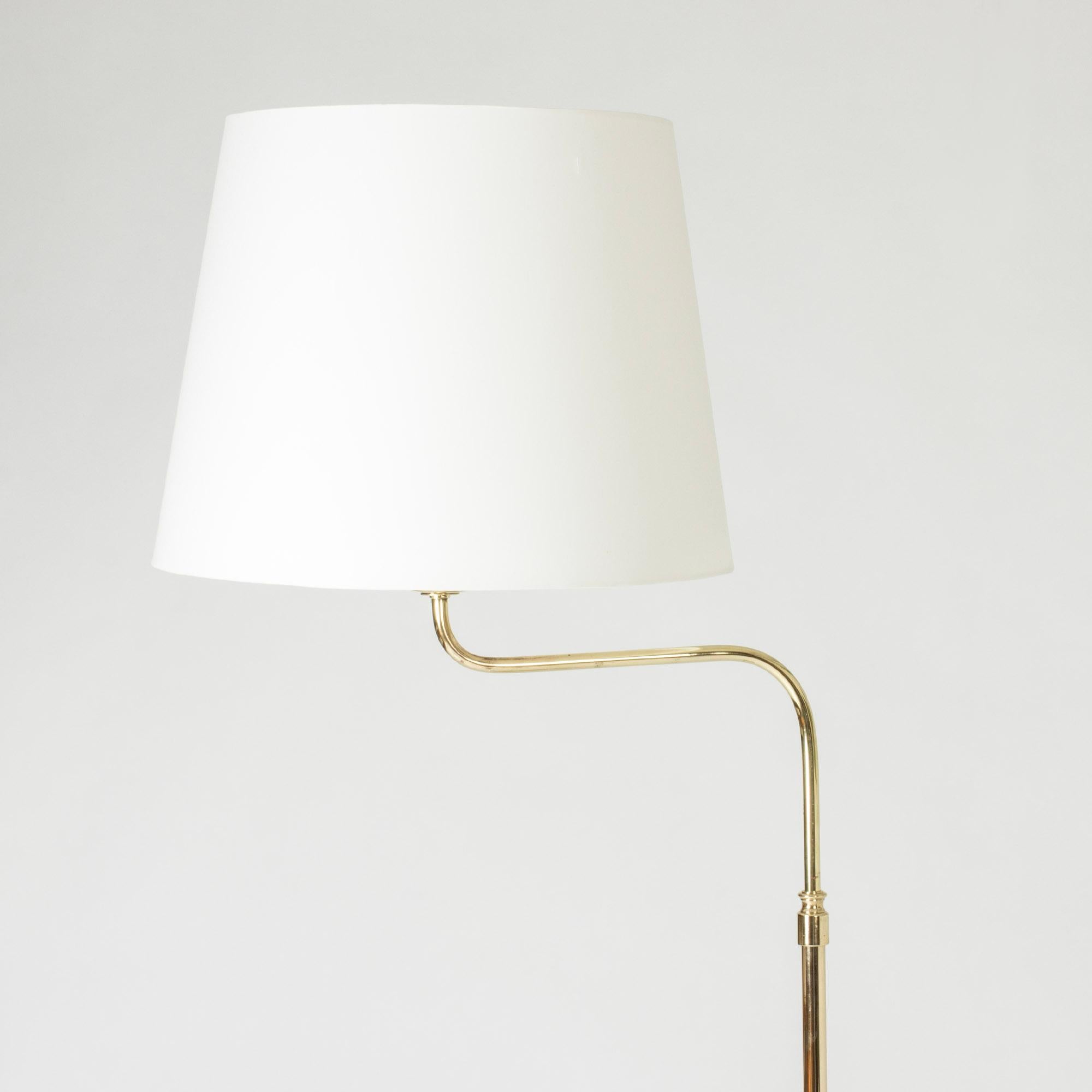 Elegant brass floor lamp from NK, with a shade whose position can be adjusted.

Measure: height 163-177 cm.
