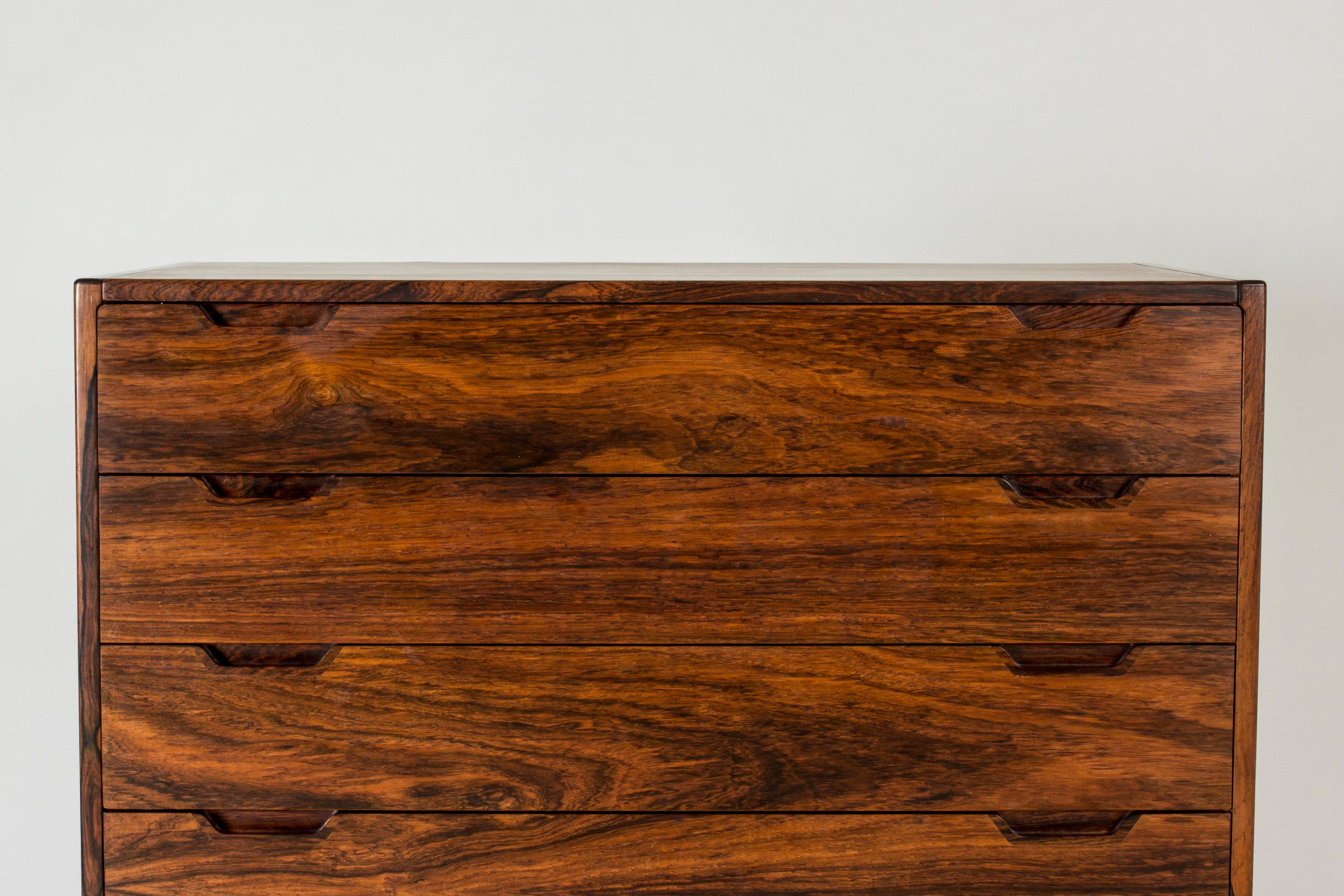 Sleek chest of drawers by Svend Langkilde, made from rosewood with beautiful woodgrain. Large model with elegant recessed handles.