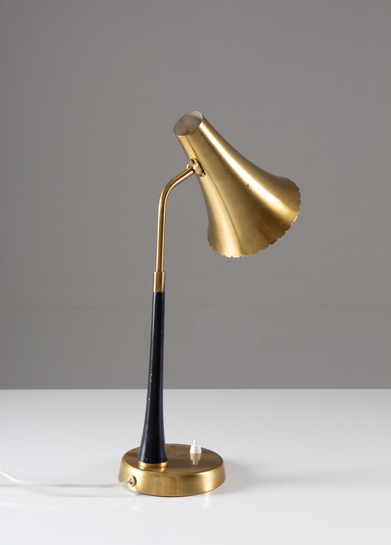 Rare desk lamp by ASEA, Sweden, model E1163.
This lamp is made from solid brass with black wooden details. 

Condition: Very good original condition.