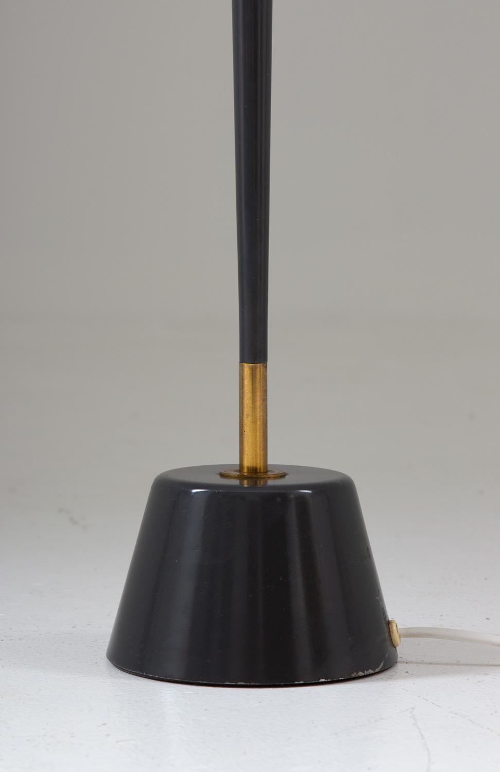 Scandinavian midcentury floor lamp by ASEA, Sweden.
This lamp consists of a blue/grey concave pole with brass details, supported by a heavy cone-shaped metal base. Very elegant and minimalistic design.

Condition: Very good original condition.