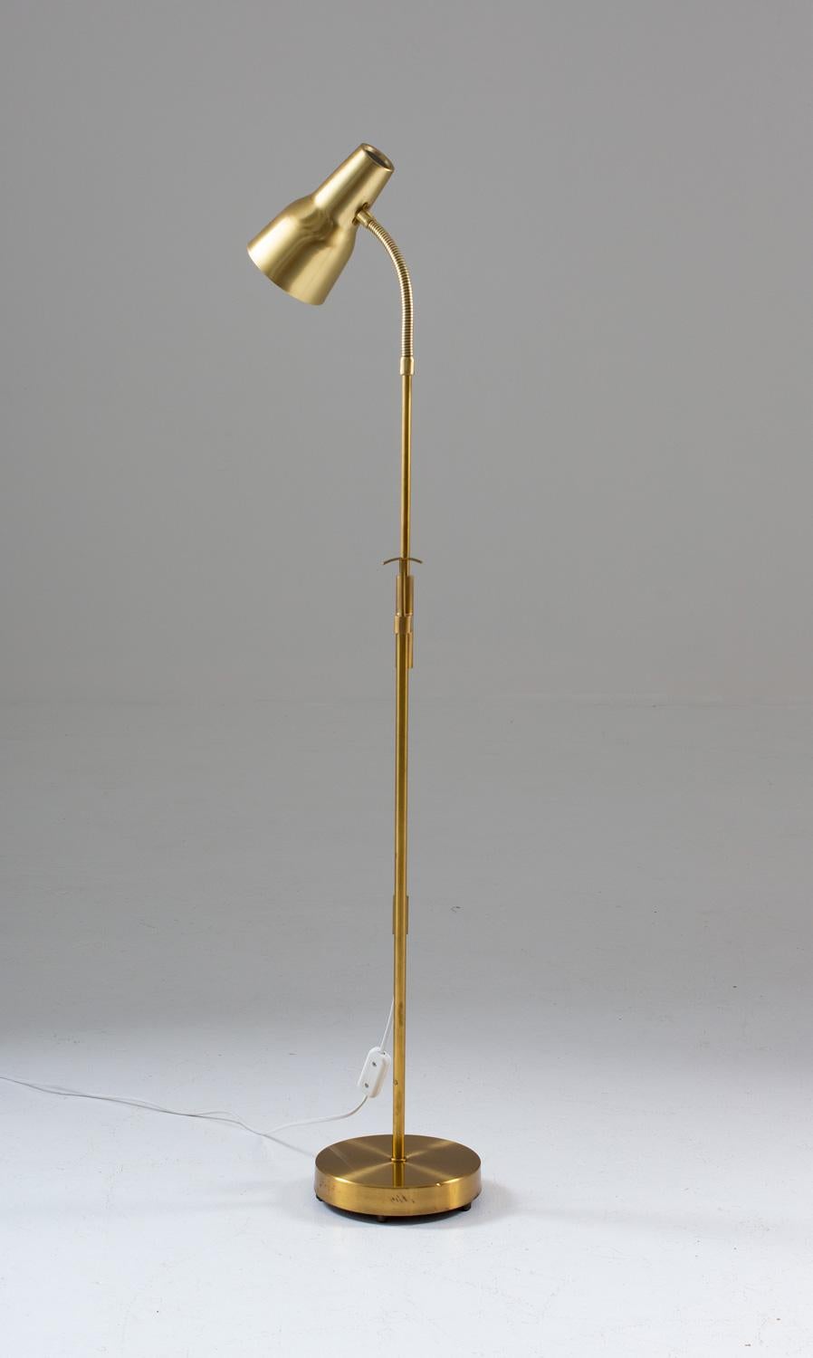 Lovely floor lamp in brass, by Swedish manufacturer Falkenbergs, Sweden. 
The lamp is adjustable in both height and angle, making it a perfect reading lamp beside the sofa. 
Condition: Very good original condition with light patina.