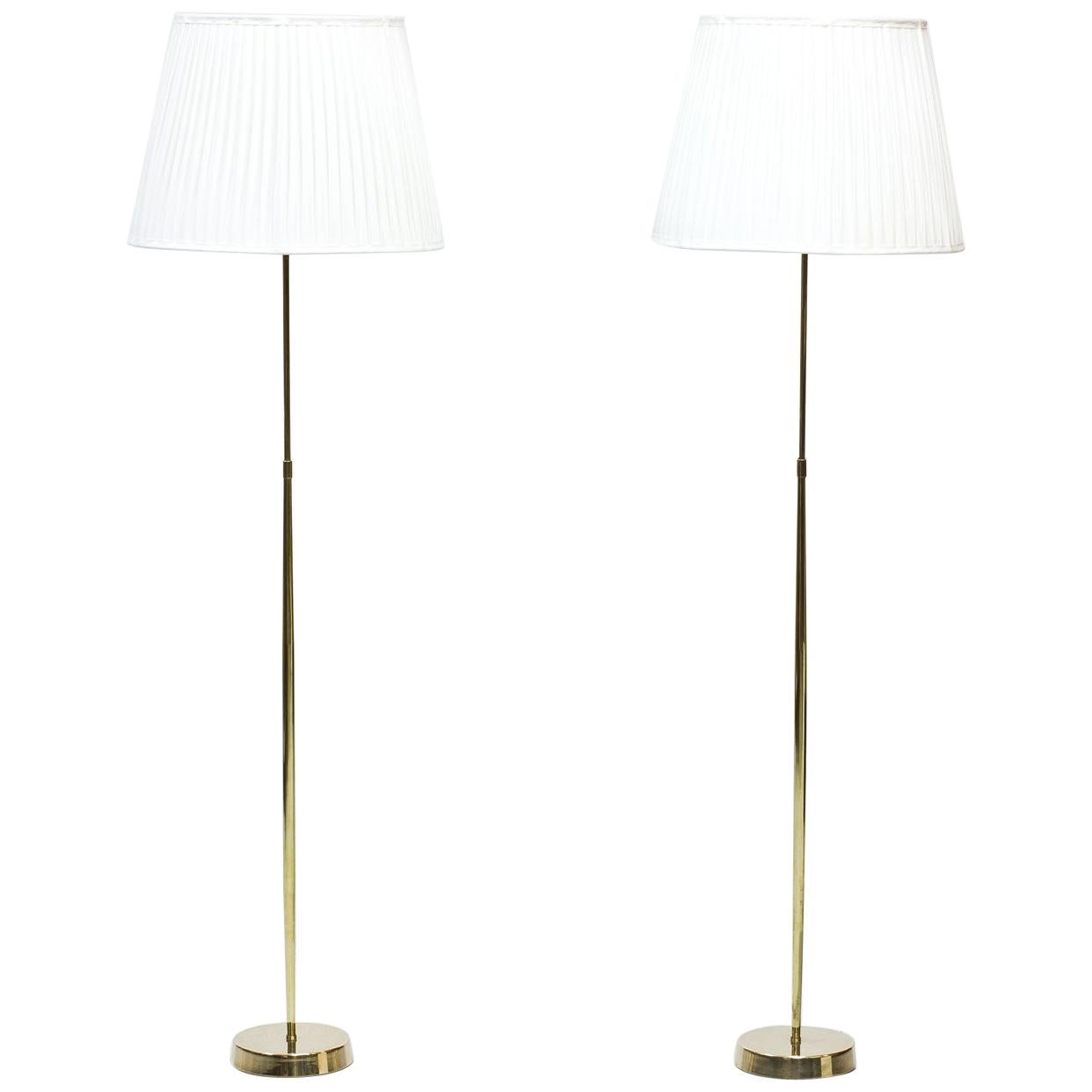 Pair of floor lamps produced by ASEA Belysning in Sweden during the 1950s. Polished brass stem. Hand pleated lamp shades in off-white chintz fabric. Rewired. Light switch on the brass.
fittings. Signed on the bottom.