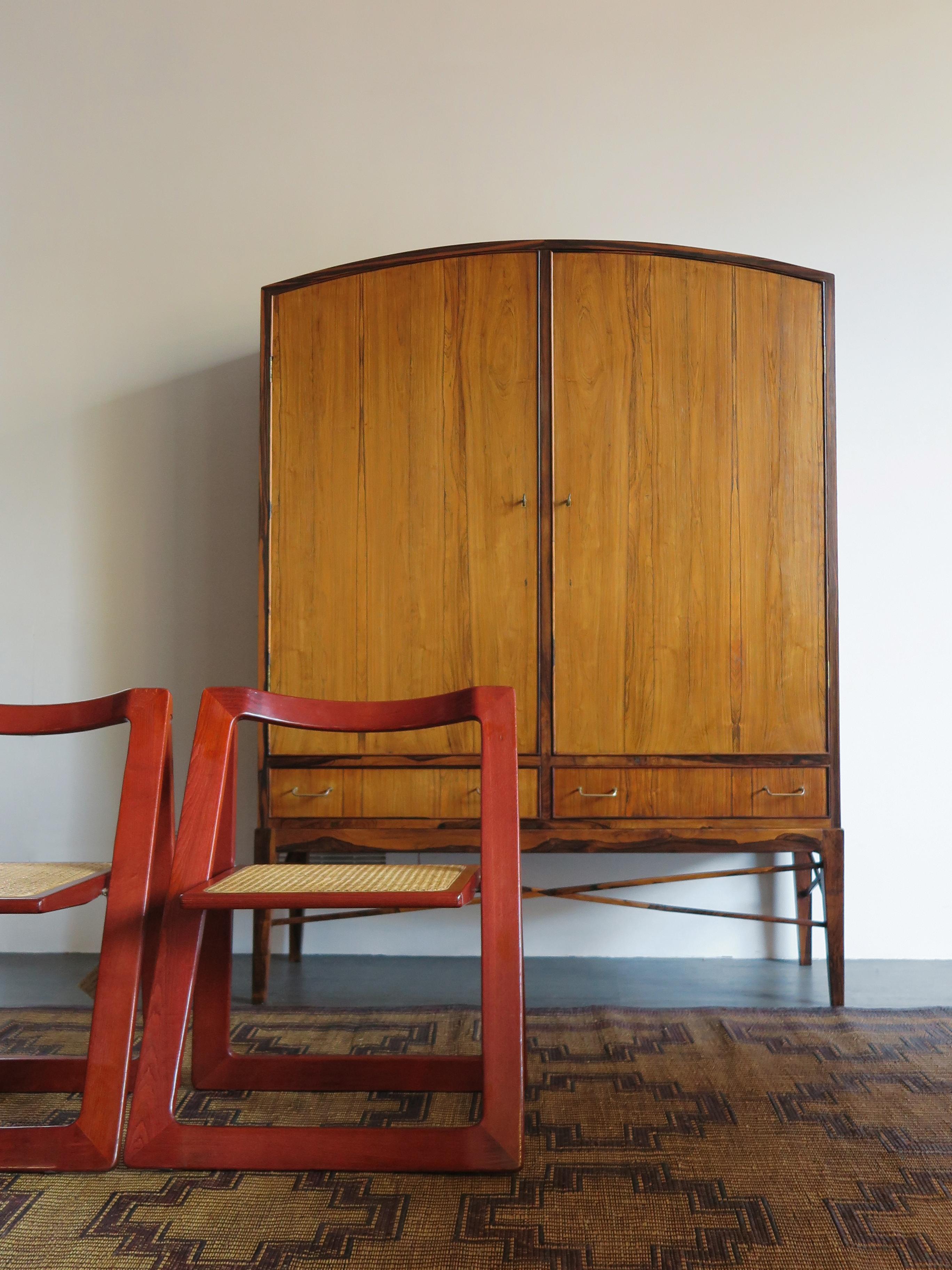 Tan France Auction Pick

Mid-century Scandinavian elegant e very raffinate dark wood cabinet with interior shelves and height-adjustable drawers, Danish manufacture 1960s

The wood has beautifully patterned grains as the photographs show, and the