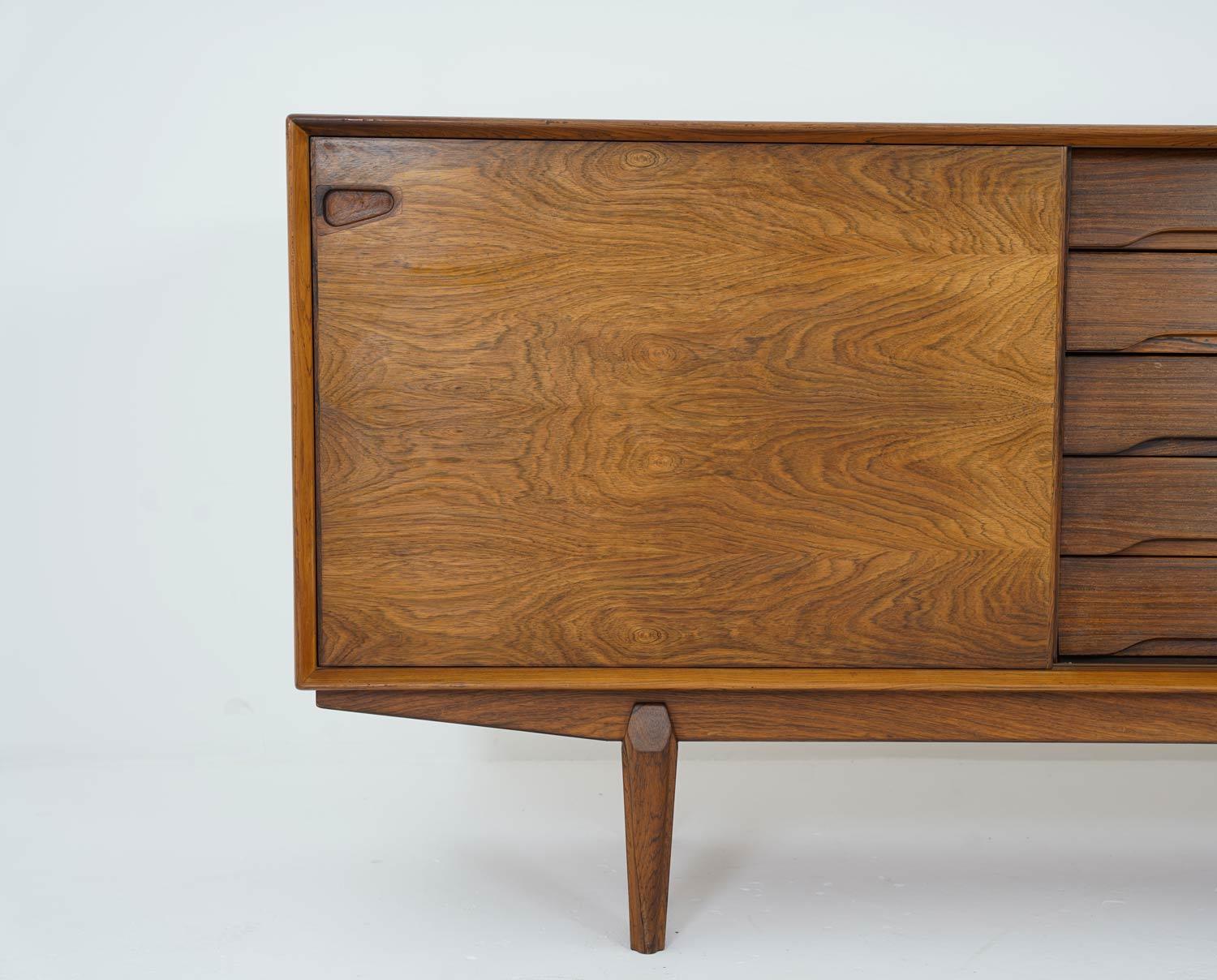 Sideboard in rosewood by Danish designer Egon Kristensen for Skovby Møbelfabrik. 
This well-built sideboard features two sliding doors with five drawers in between.

Condition: Good original condition with normal signs of use and age.