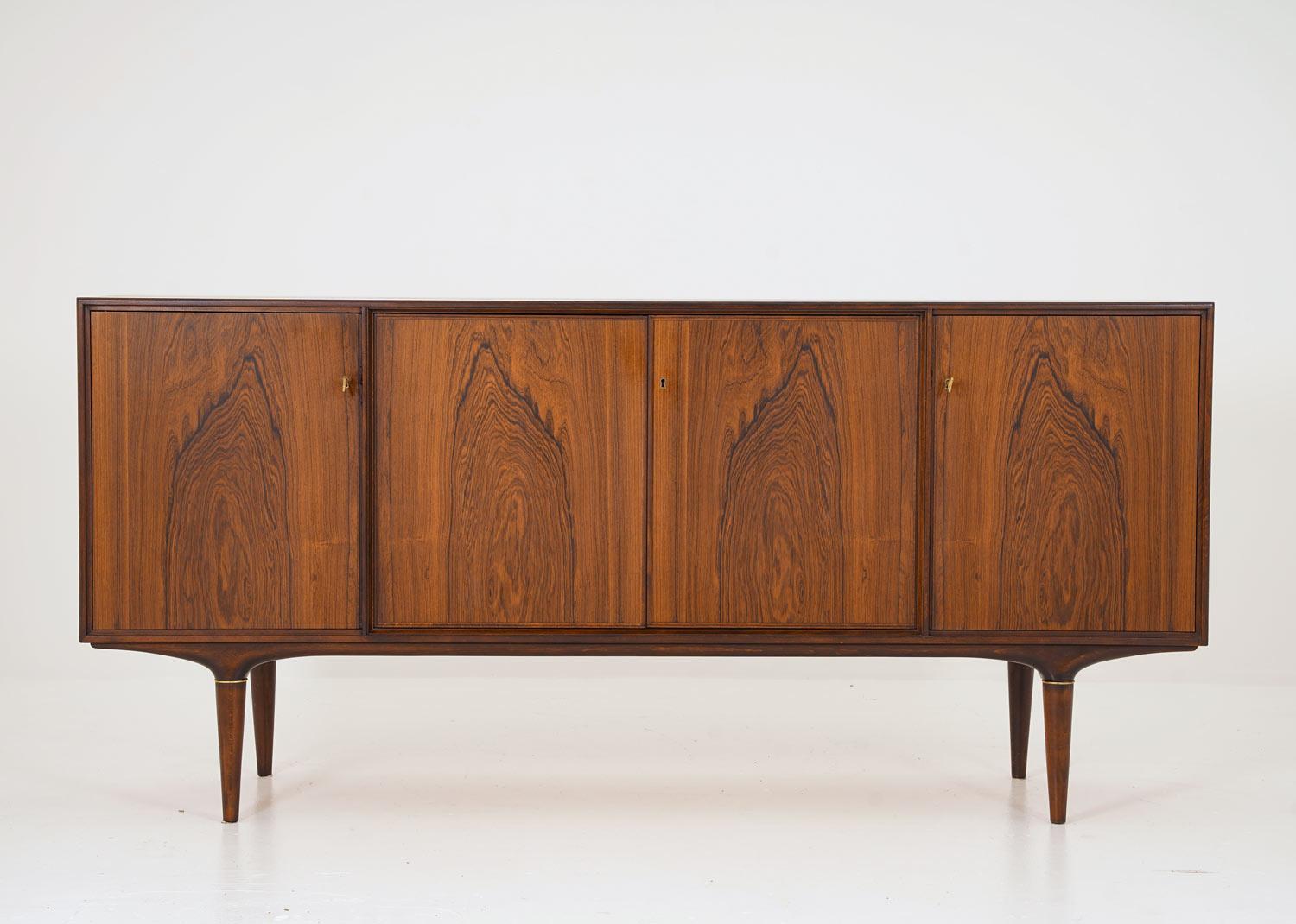 Rare sideboard in rosewood by Swedish designer Svante Skogh for Seffle Möbelfabrik. 
This sideboard features four doors, creating a magnificent rosewood wall on the front. Only the best veneer parts have been used for this sideboard with stunning