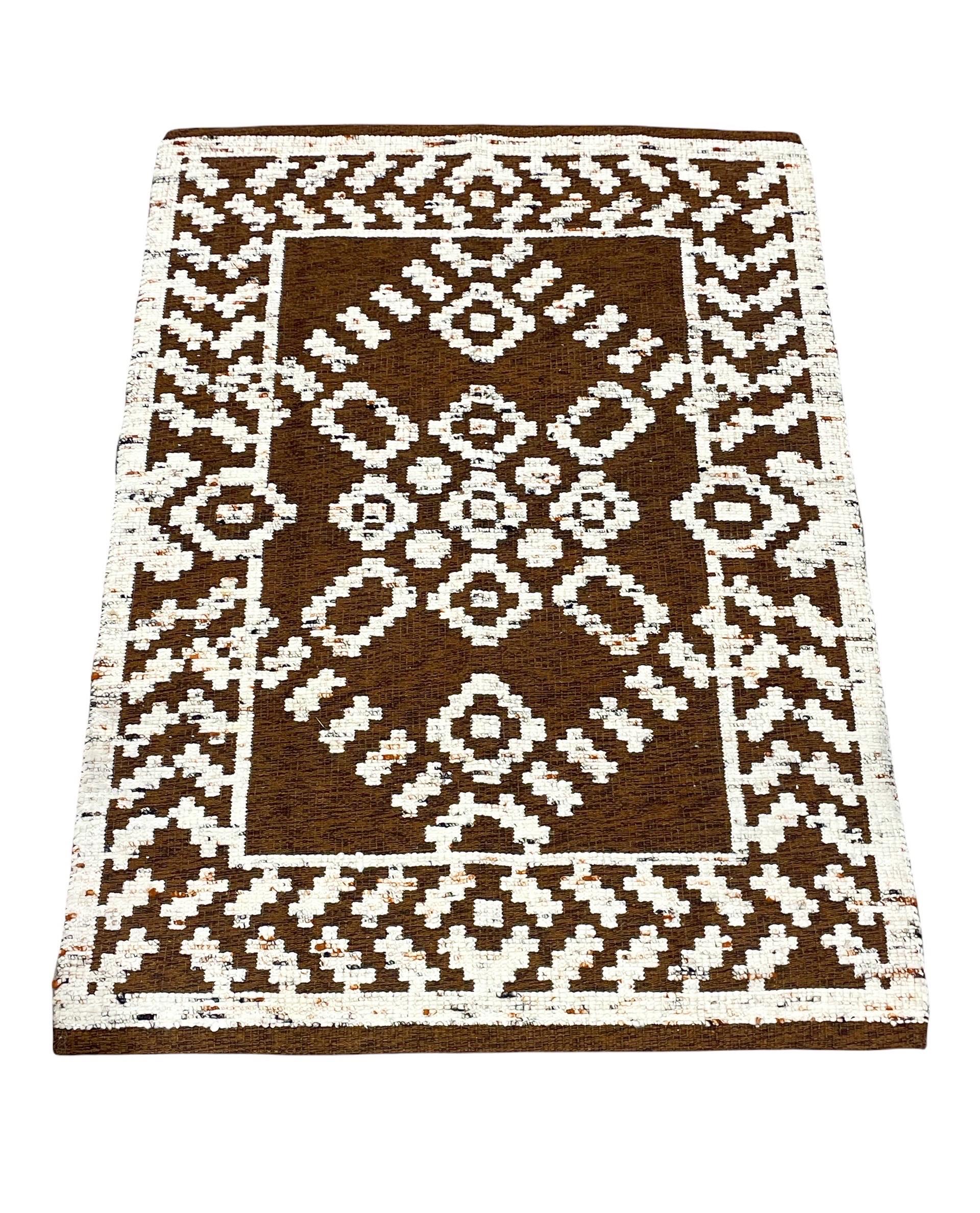 Mid-century Scandinavian Modern hand knotted wool area rug by Astrid Sampe for Tabergs, Sweden circa 1970s. Reversible design. Warm chocolate browns and creamy whites with hints of oranges and black.

This rug is NOS (New Old Stock). It has never