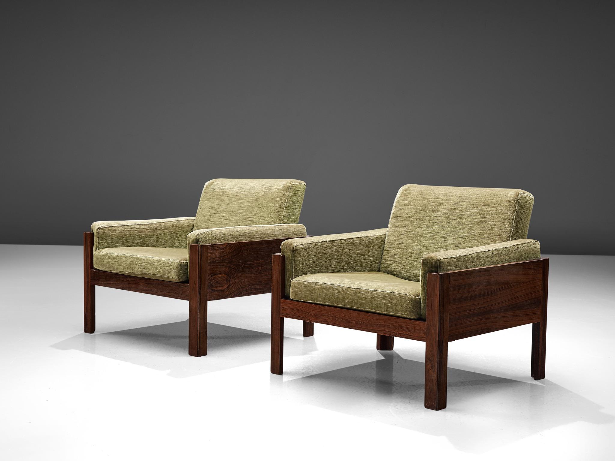 Lounge chairs in rosewood and green fabric, Scandinavia 1960s.

This set of lounge chairs have a minimalist, modest and modern design. The chairs feature an open character due to the generous space underneath and the use of straight elements. The
