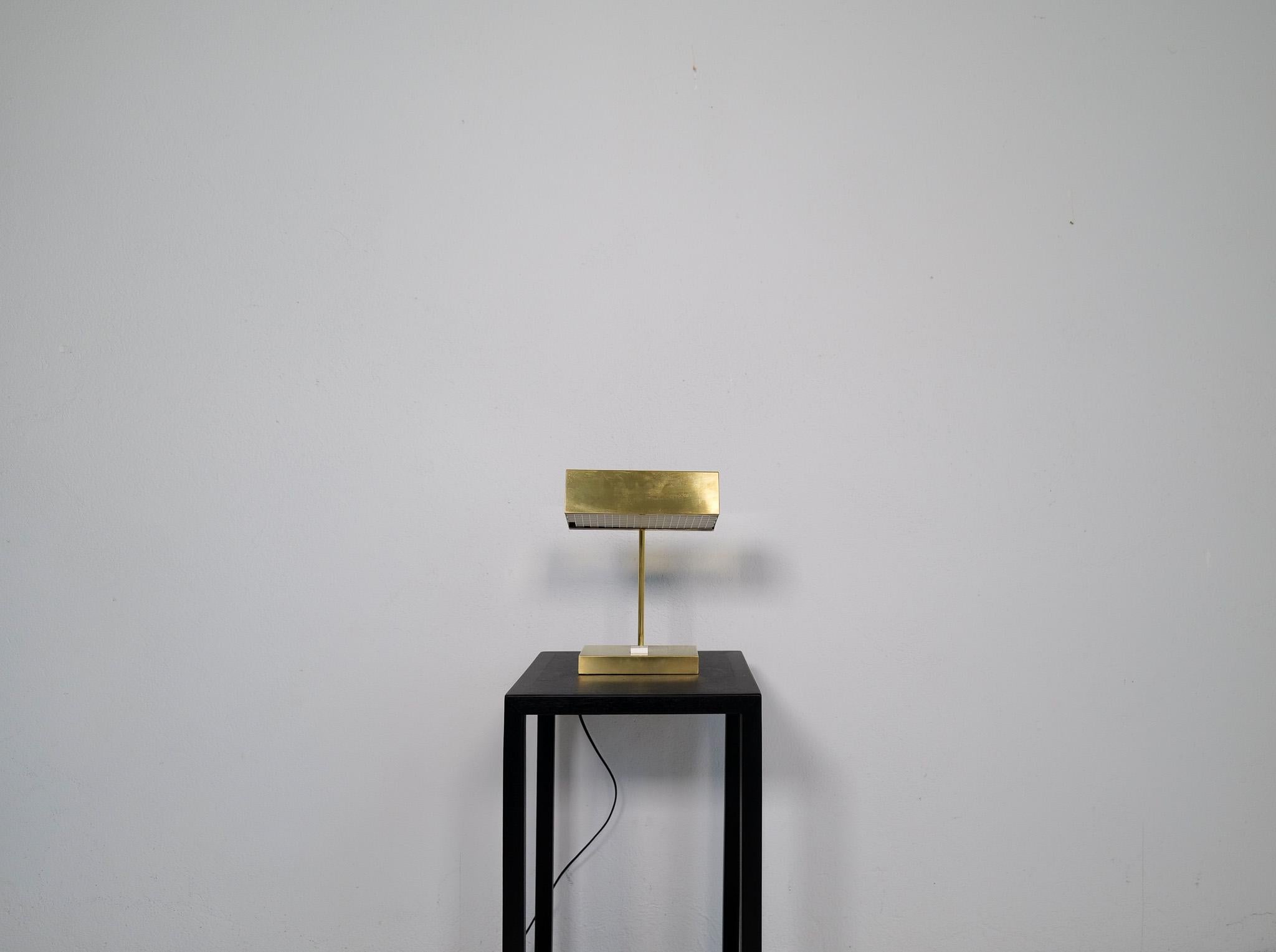 This adjustable minimalistic table lamp / desk light in brass, was design by Björn Svensson. Produced in Sweden by “Elidus” in the 1970. 

Hans-Agne Jakobsson was one of the designers at the company 