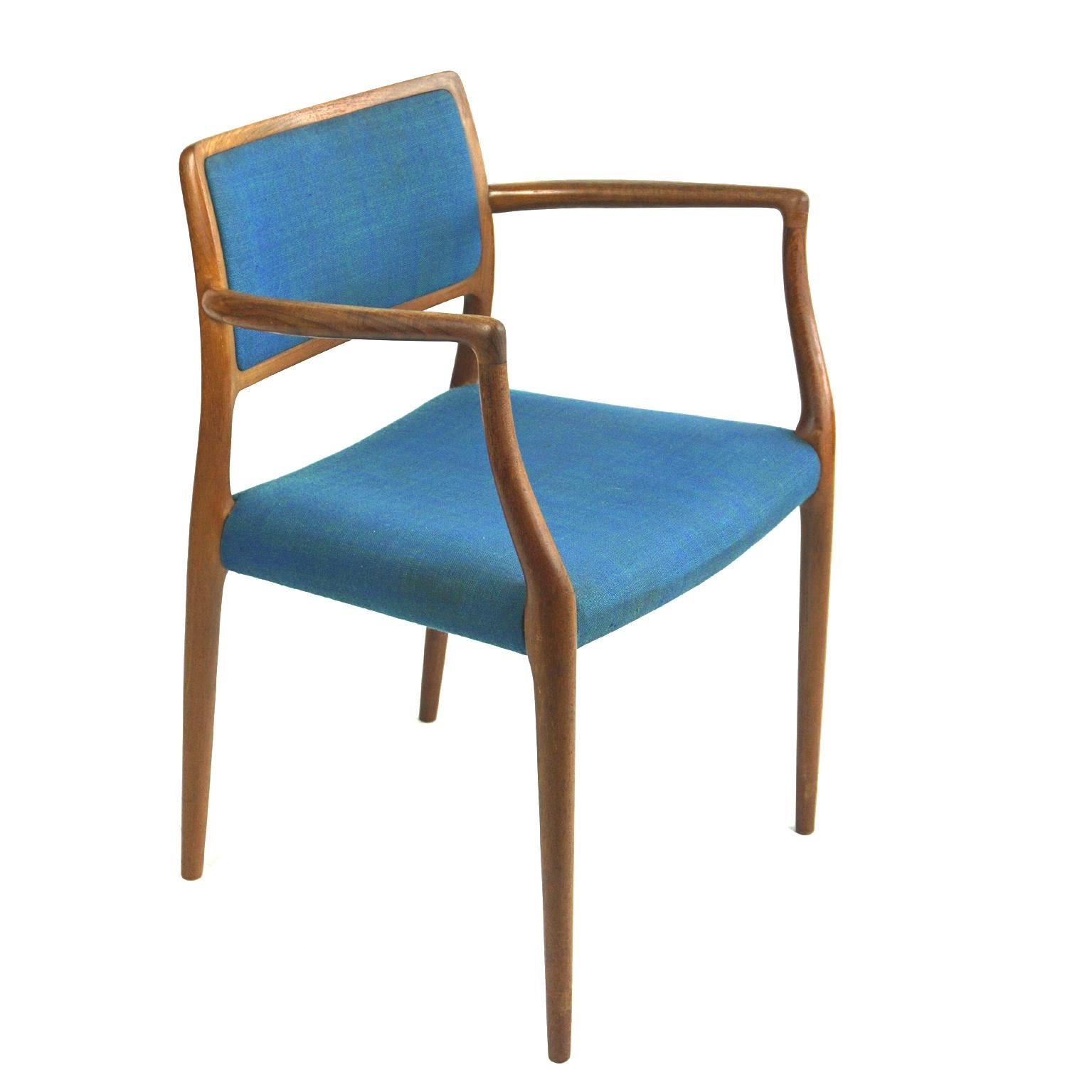 Scandinavian Modern Mod. 65 teak dining armchair designed by Niels Otto Moller for his own company: J.L. Moller Mobelfabrik in Denmark, in the 1960s.
The Hand-shaped solid teak frame exemplifies Møller’s signature sculptural approach. Very