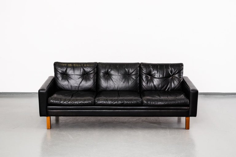 Scandinavian Modern 1960s Black Leather Three-Seat Sofa with Teak Legs at  1stDibs
