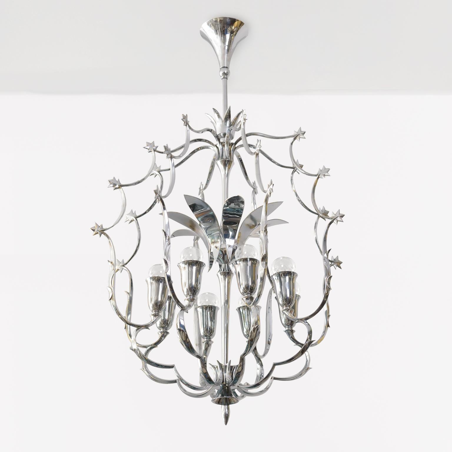 A large Scandinavia Modern 8 light chandelier in chromed brass. The fixtures structure consist of a series of graceful arches meeting at leaf like joints. At the center is a cluster of arched curved reflectors. Newly restored and rewired with