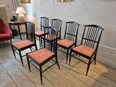 Scandinavian Modern, a set of six chairs, model Charlotte, black lacqured wood