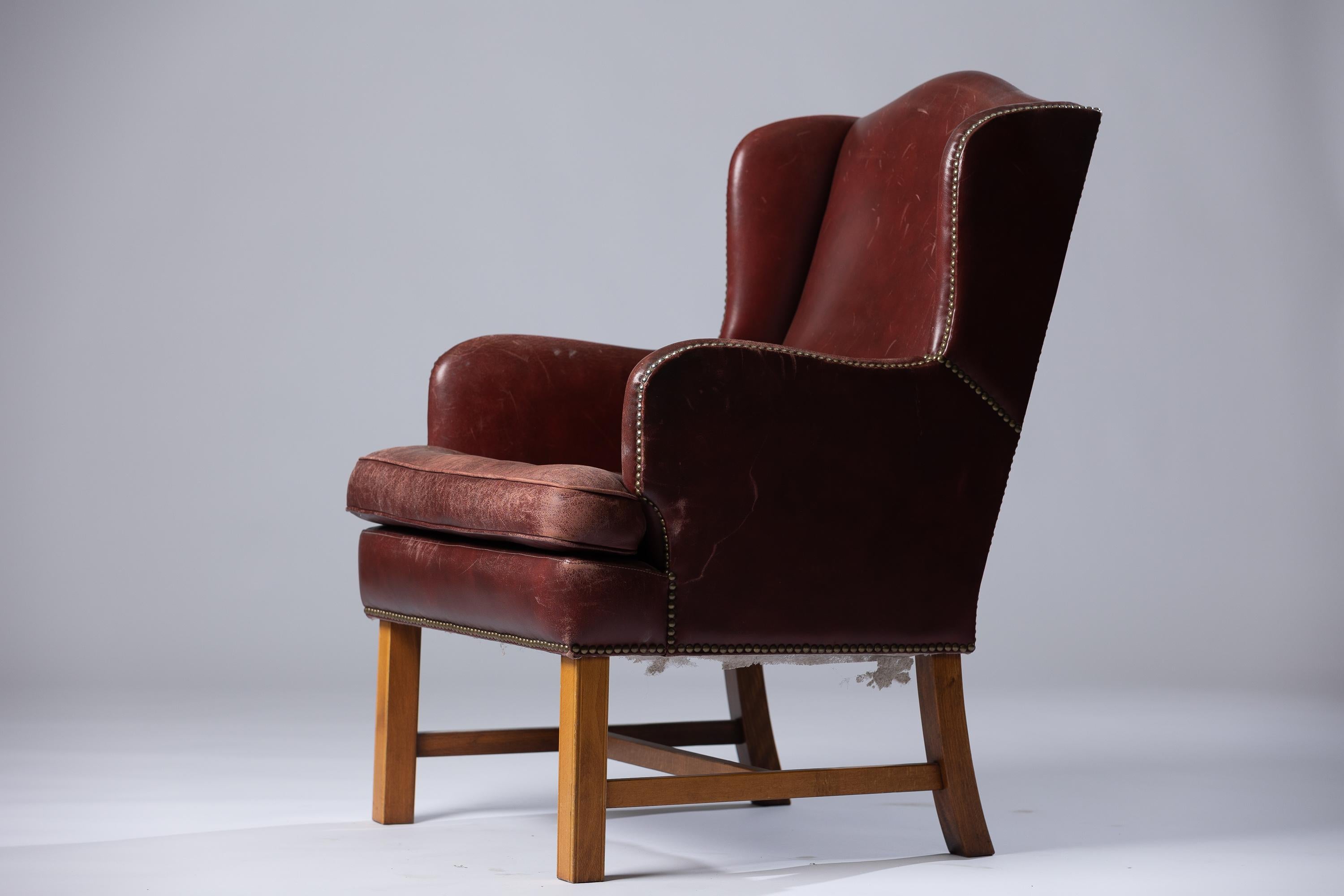 Élevez votre intérieur avec le fauteuil en cuir The Modern Scandinavian Modern fabriqué par le légendaire designer Arne Norells. Cette pièce emblématique incarne l'essence du design scandinave, caractérisé par ses lignes épurées, sa fonctionnalité
