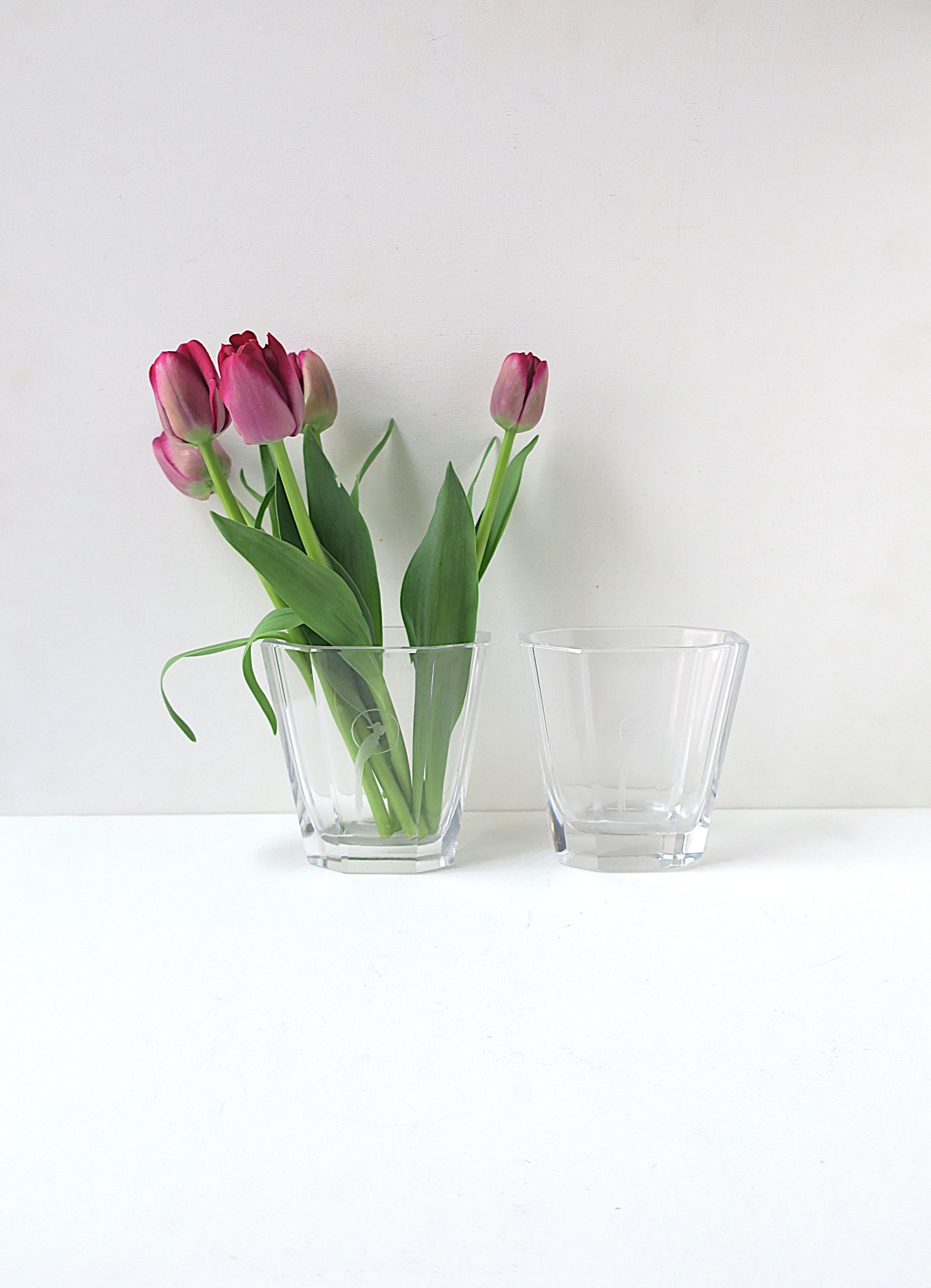A beautiful pair of Swedish Modern/Scandinavian Modern crystal octagonal vases with etched parrot bird design on front, Art Deco design, by Kosta Boda, circa early to mid-20th century, Sweden. Signed and numbered on bottom as shown in last two