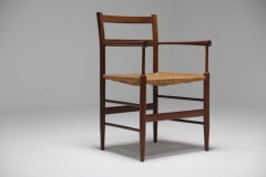 Scandinavian modern arts and crafts Sussex style teak armchair.