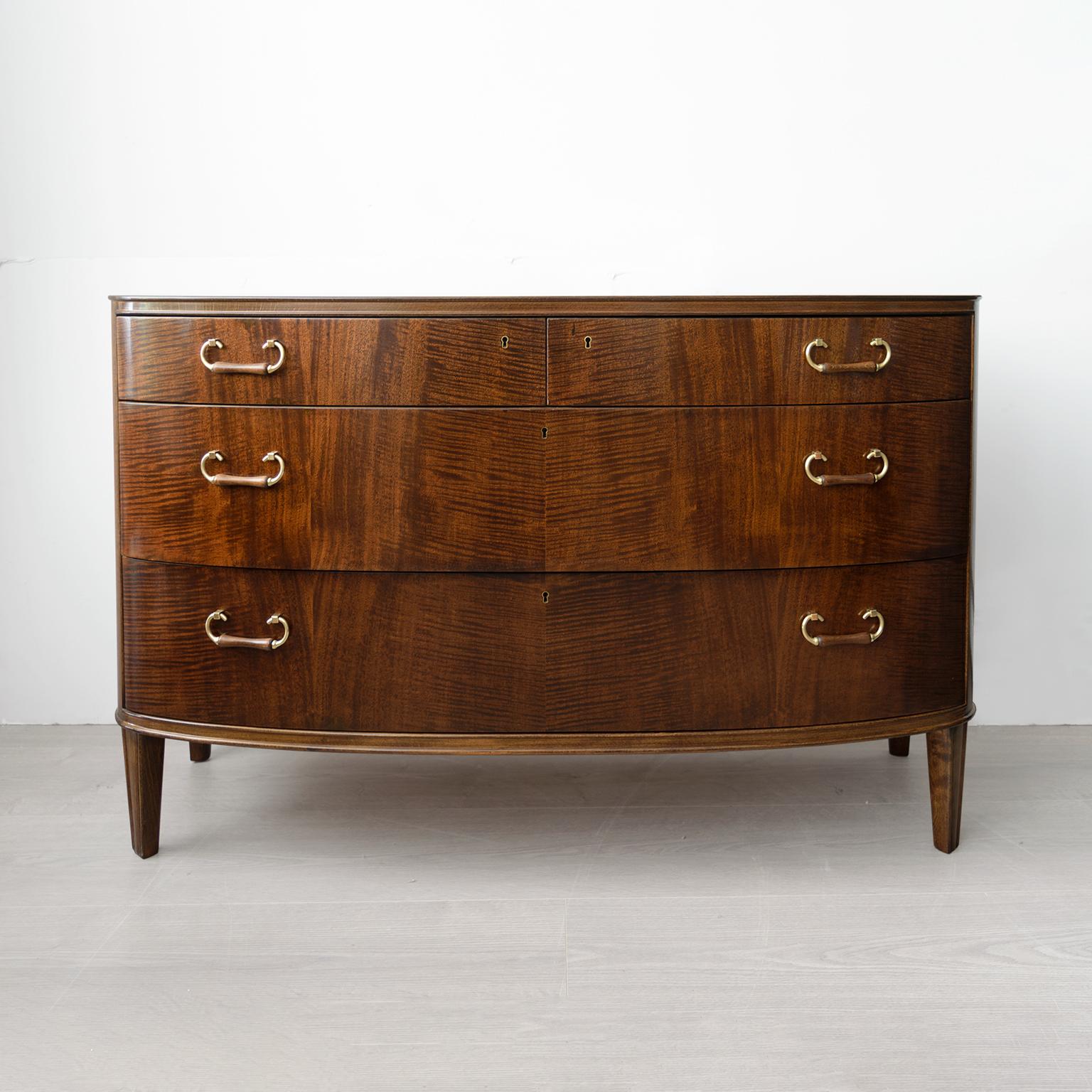 Axel Larsson designed “Rosita” series, stained sycamore chest with 4 drawers detailed with carved wood and polished brass handles. Made for SMF Bodafors, Sweden, circa 1940’s. Fully restored condition. 

Measures: Height: 28”, width: 43.25” depth: