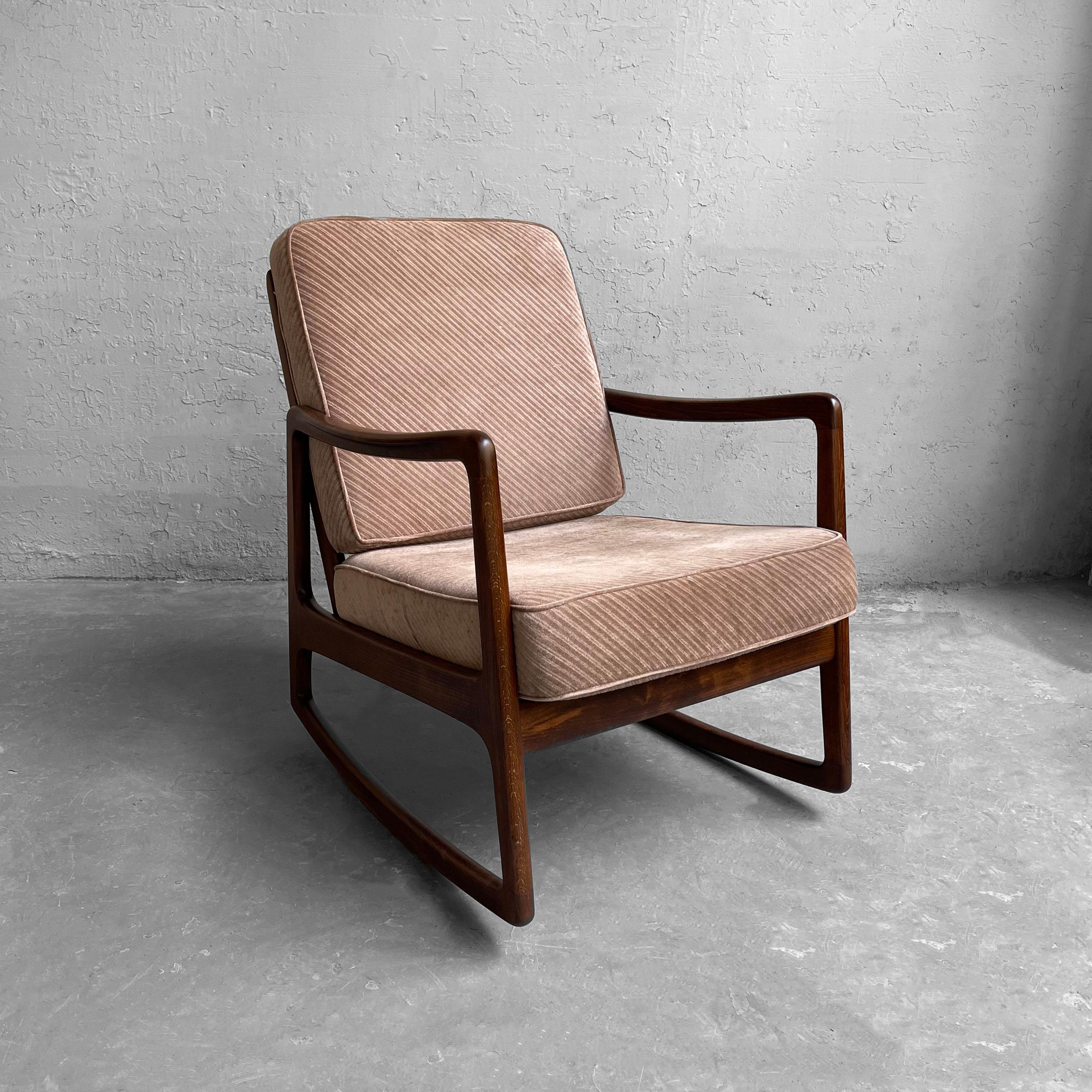 Danish modern, rocking chair by Ole Wanscher for France & Daverkosen features a graceful, beech wood frame with blush corduroy chenille upholstered cushions.