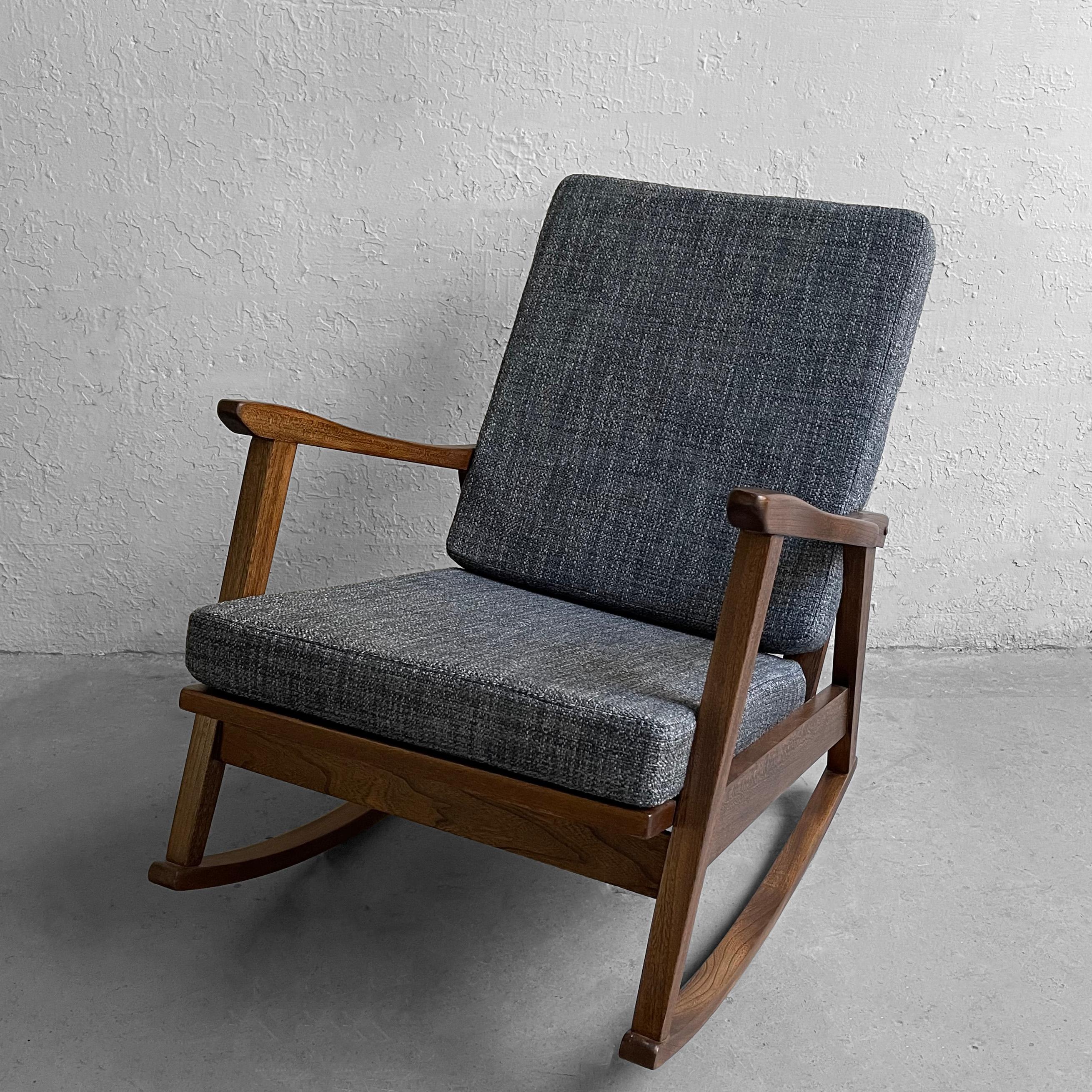 Scandinavian modern, rocking chair features a stylish and solid beech frame with newly upholstered cushions in blue tweed wool blend. Scandinavian modern design produced in Yugoslavia circa 1960's.

