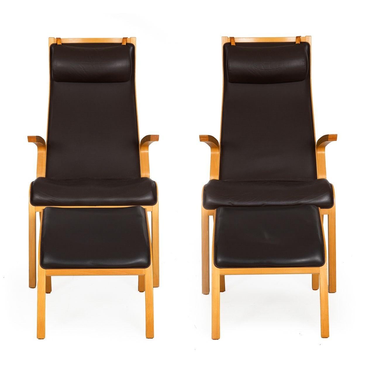 PAIR OF SCANDINAVIAN MODERN BENTWOOD AND LEATHER ARM CHAIRS WITH OTTOMANS
20th century, unmarked
Item # 211GUH29P 

A sleek and austere pair of bentwood chairs in the modernist taste, they feature curved lengths of laminated beech and are