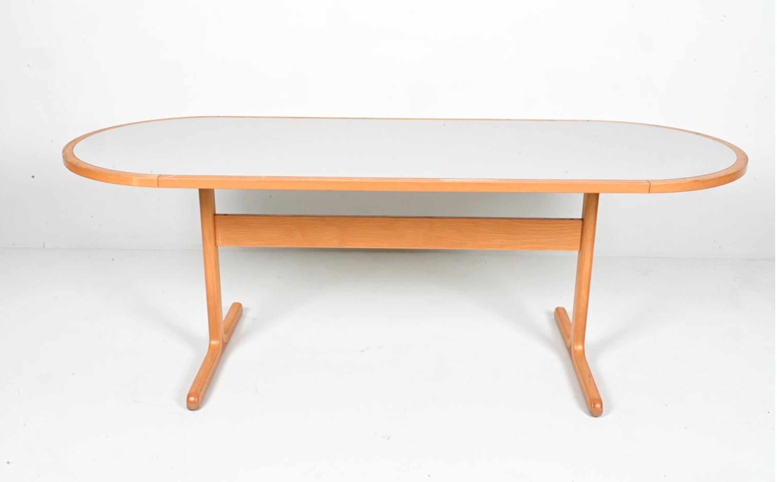 Scandinavian Modern Birch and light gray Laminate oval Racetrack Dining table with trestle legs. Designed by Rud Thygesen & Johnny Sorensen. Very simple clean design. Shows normal wear and use otherwise clean and stable. Scandinavian Modern made c.