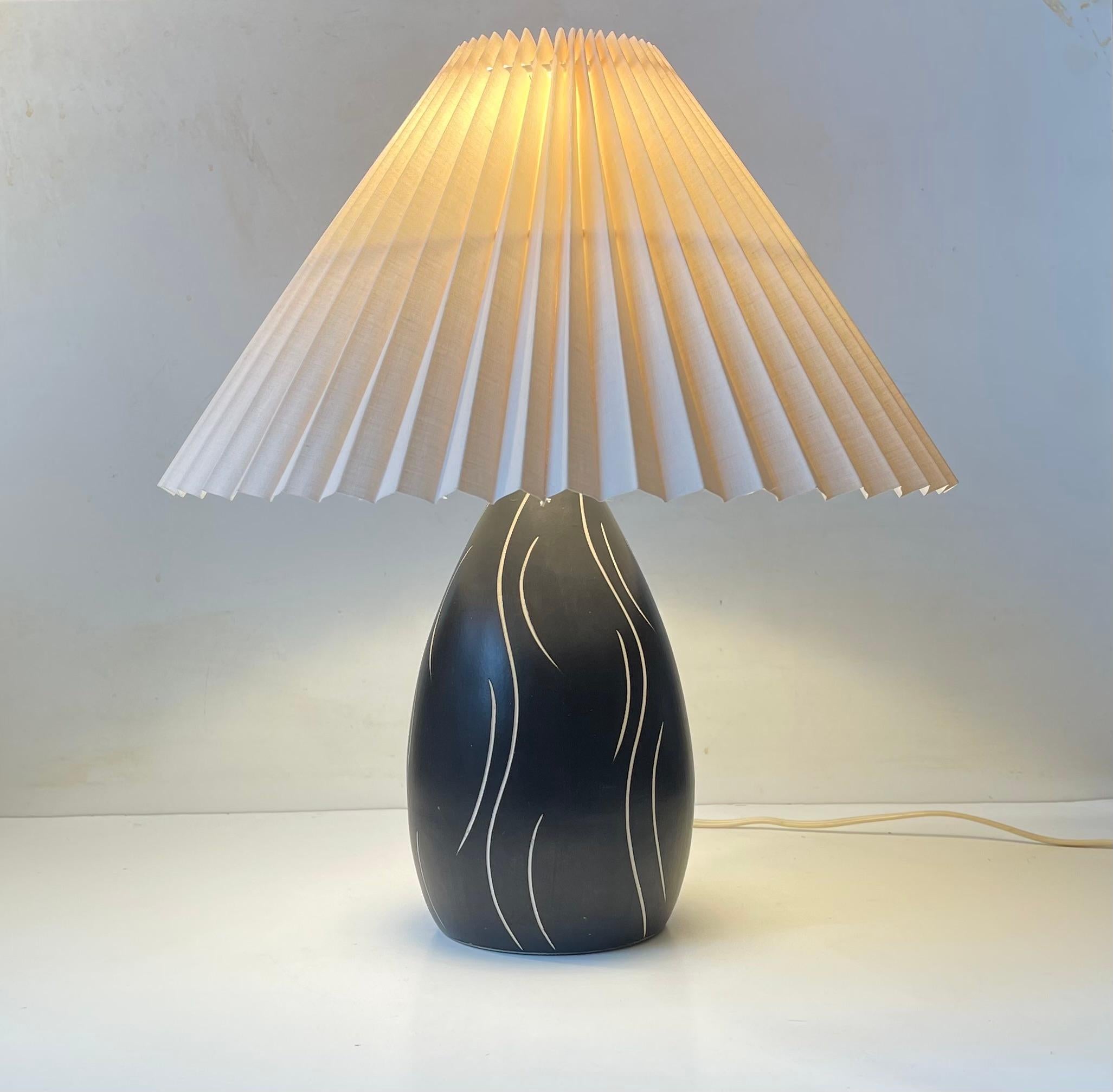 - Black and white glazed ovoid Ceramic table lamp decorated in sgrafitto style. Designed and made by Elisabeth Loholt in Denmark during the 1950s in a style reminiscent of Ingrid Atterberg and Michael Andersen. Made for E. S. Horn in Denmark. This