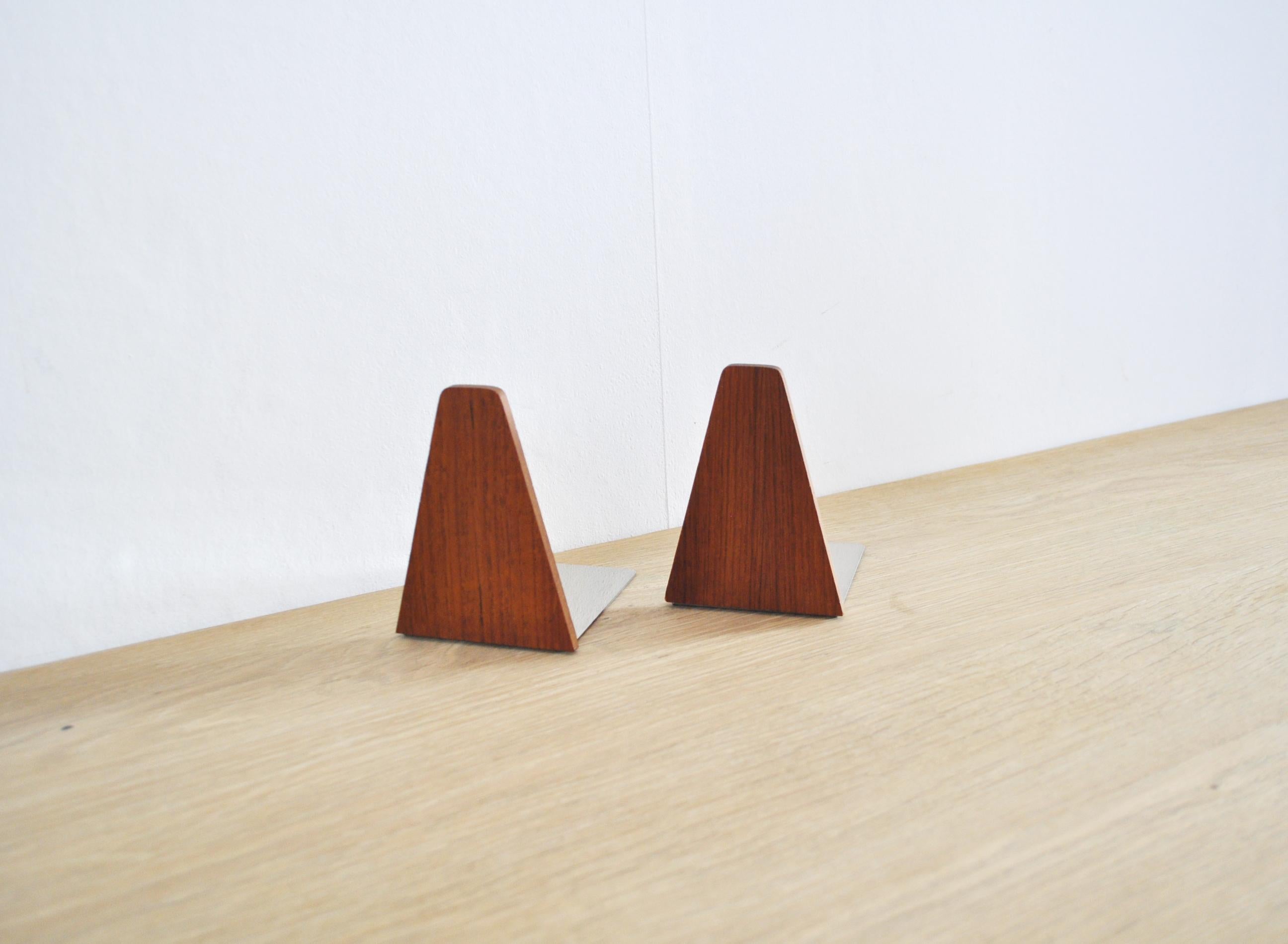 A set of two bookends in teak with steel rests,
Denmark, 1960s. Signs of wear consistent with age.