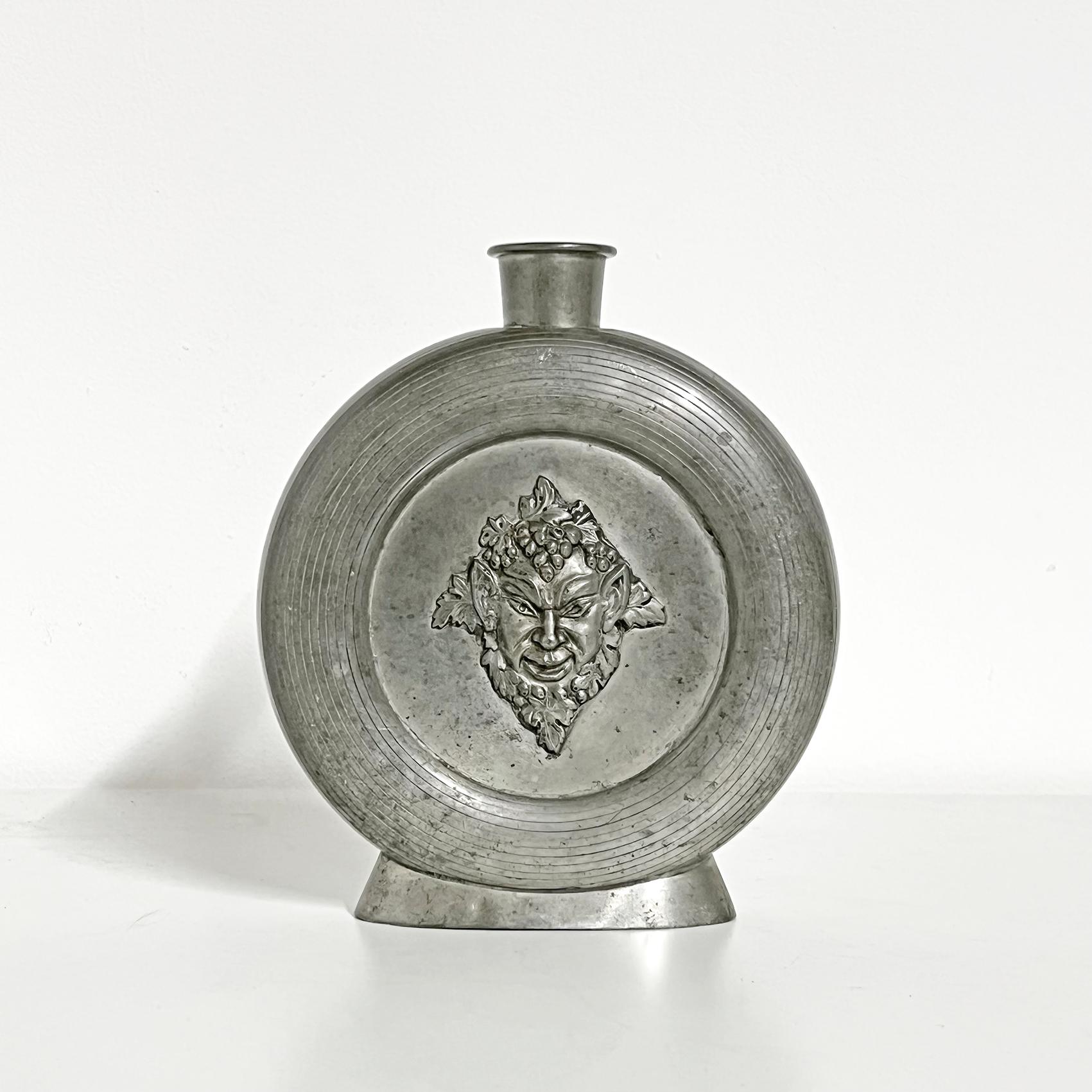 Cool and rare scandinavian modern bottle in pewter depicting Bacchus, by CG Hallberg -1934. 
The bottle stopper is missing. Engraving, as seen on the pictures.
Signed with makers mark underneath. 
Good vintage condition, wear and patina consistent