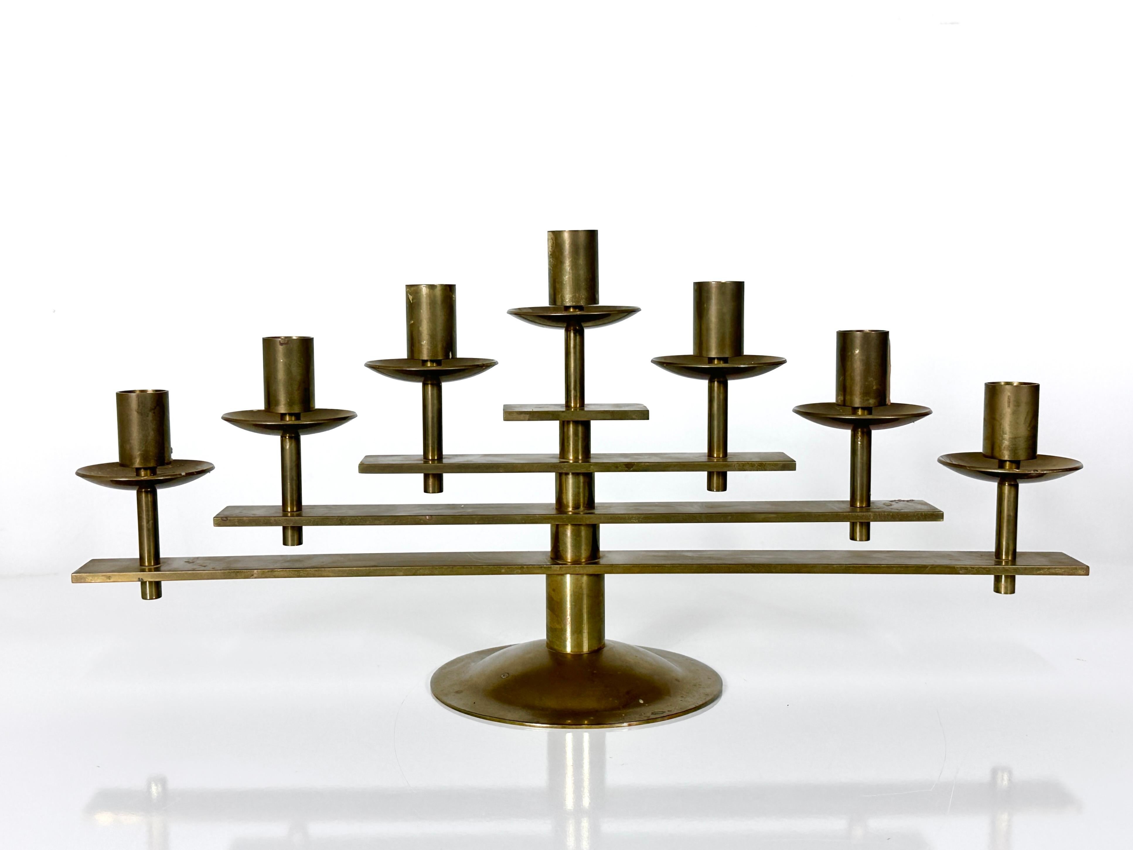 Solid brass 7 arm articulated candelabra designed and made in Denmark circa 1960s

Architectural yet elegant design with adjustable arms to create various configurations

Original label intact to underside