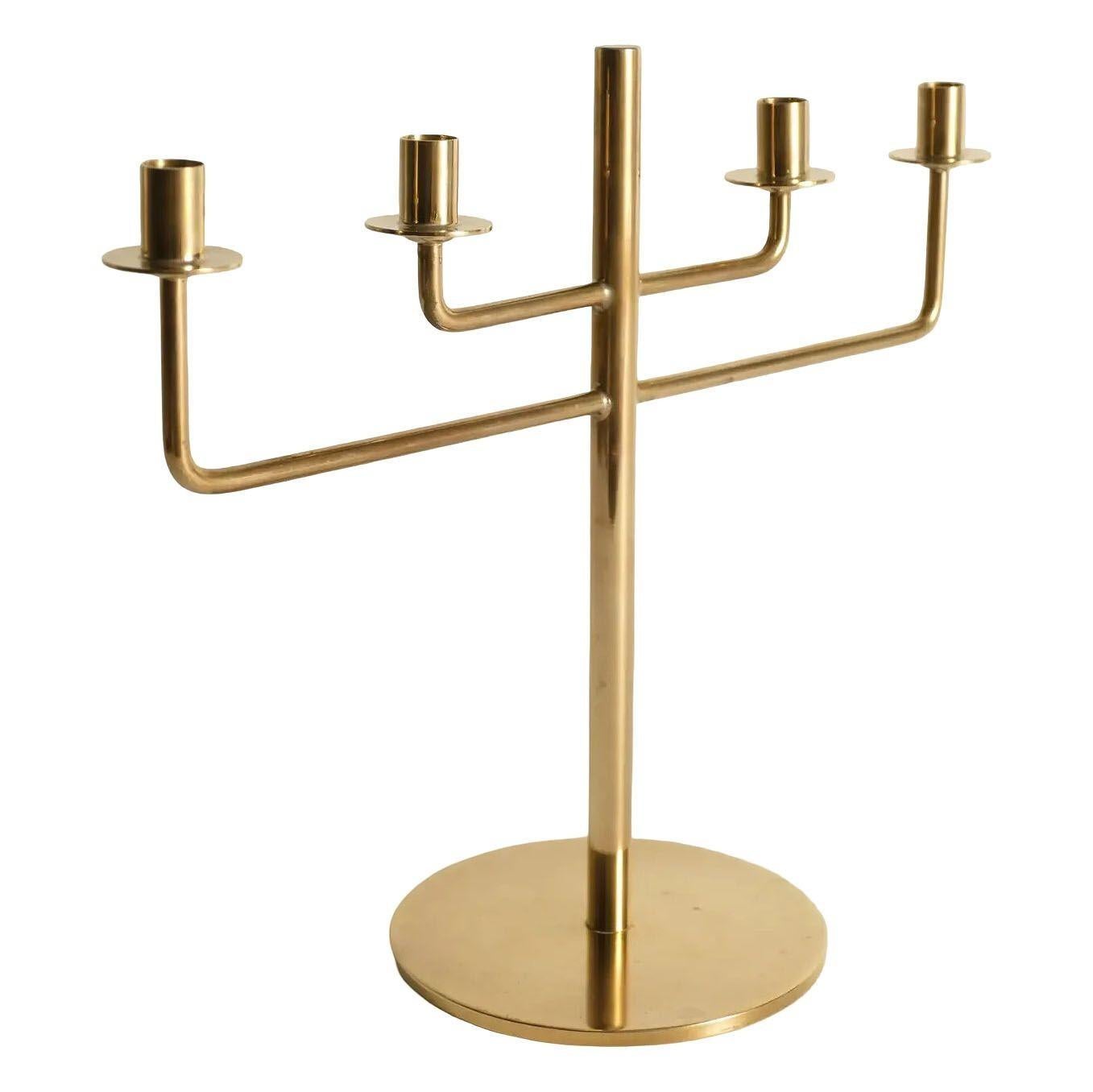 This rare brass candelabra set was designed by the iconic Scandinavian modernist Hans-Agne Jakobsson, is a beautiful example of his work from the 1960s. Known for his innovative approach to lighting, Jakobsson created this Model L29 brass candelabra